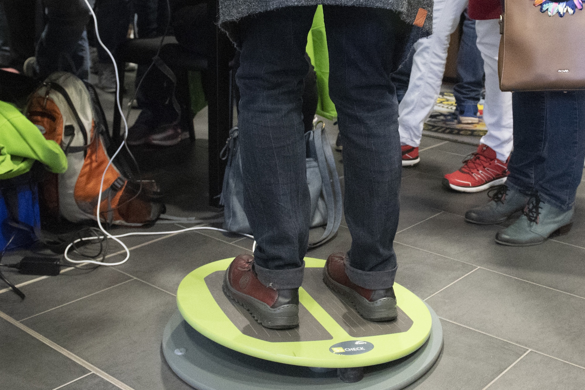 A participant tests their balance on a stability device at the local-national health fair at Spangdahlem Air Base, Germany, Sept. 24, 2019. The assessment displays deep-tissue balance issues and can offer corrective advice for preventing back problems. (U.S. Air Force photo by Airman 1st Class Alison Stewart)