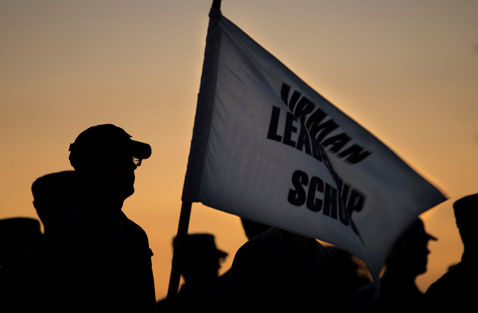 U.S. Air Force Airmen stand in an Airman Leadership School formation during a Reveille ceremony at Shaw Air Force Base, South Carolina, Sept. 16, 2019.