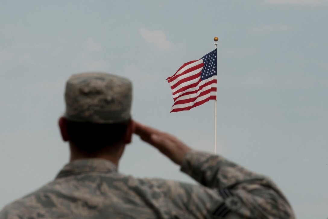 U.S. Air Force Senior Airman Daniel Caraglio, prisoner of war/missing in action (POW/MIA) project officer, salutes the American flag during a retreat ceremony, at Shaw Air Force Base, South Carolina, Sept. 17, 2019.