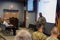 Air Force Master Sgt. Seneca Linder gives suicide prevention training to Joint Task Force Civil Support members at the command’s headquarters. During the brief, members learned about some of the risk factors and signs of potential suicide, and how to help someone facing suicide. (Official DoD photo by Mass Communication Specialist 3rd Class Michael Redd/RELEASED)