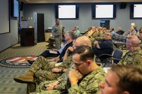 Air Force Master Sgt. Seneca Linder gives suicide prevention training to Joint Task Force Civil Support members at the command’s headquarters. During the brief, members learned about some of the risk factors and signs of potential suicide, and how to help someone facing suicide. (Official DoD photo by Mass Communication Specialist 3rd Class Michael Redd/RELEASED)