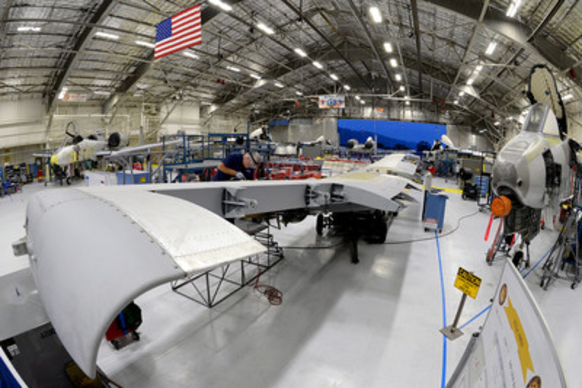 A 571st Aircraft Maintenance Squadron mechanic works on the wing of an A-10 Thunderbolt II aircraft at Hill Air Force Base, Utah. The squadron is part of the Ogden Air Logistics Complex, which partners with DLA to provide logistics support for maintenance of fighter aircraft including the F-35 Lightning II, F-22 Raptor, F-16 Fighting Falcon and A-10 Thunderbolt II. (DoD photo by Alex R. Lloyd)