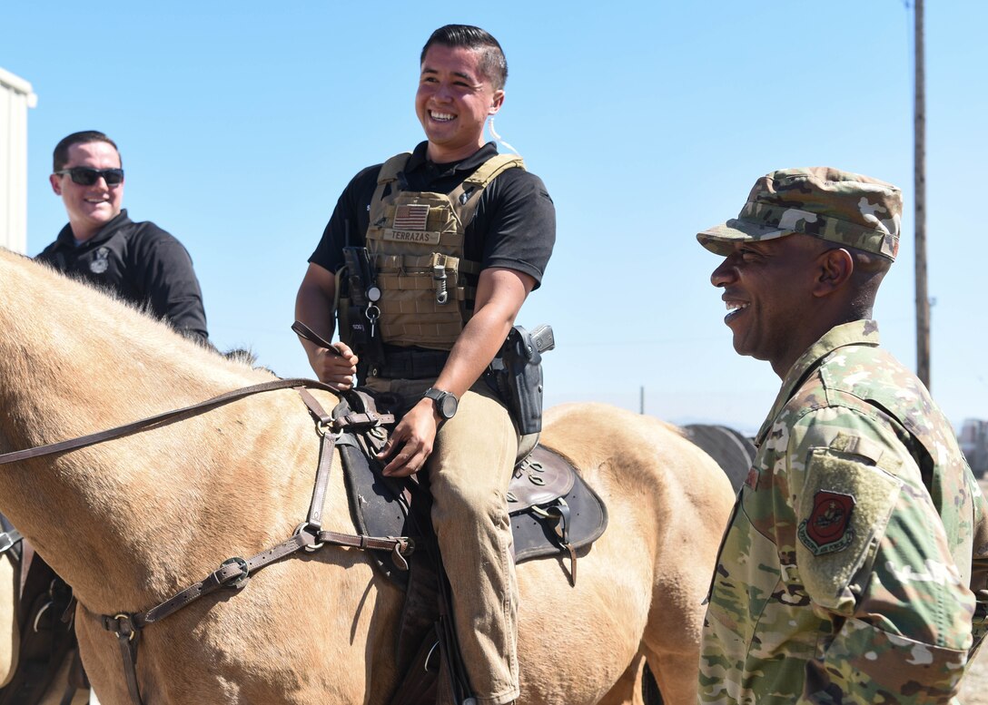 Chief Master Sergeant of the Air Force Kaleth O. Wright greets Senior Airman Michael Terrazas, 30th Security Forces conservation patrolman, and Military Working Horse Duke Sept. 25, 2019, at Vandenberg Air Force Base, Calif. The 30th SFS MWH law enforcement unit is the only equine patrol unit within the Department of Defense and is one of four conservation units in the U.S. Air Force. (U.S. Air Force photo by Airmen 1st Class Hanah Abercrombie)