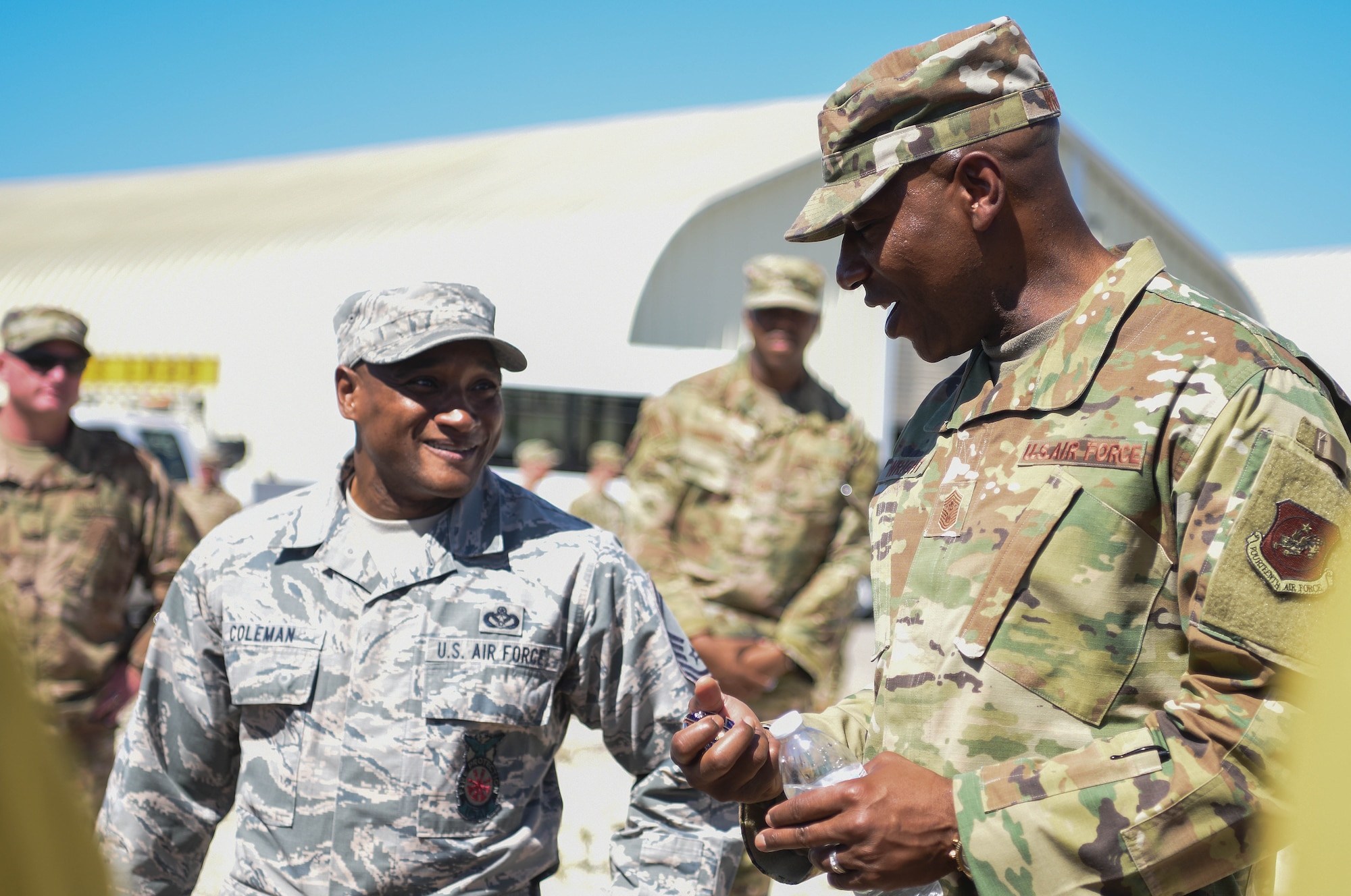 Chief Master Sergeant of the Air Force Kaleth O. Wright talks with Senior Master Sgt. Corey Coleman, 30th Civil Engineer Squadron deputy fire chief, while visiting the 30th Civil Engineer Squadron high voltage pole training yard for a demonstration Sept. 25, 2019, at Vandenberg Air Force Base, Calif. Wright was able to meet with members assigned to the Air Force’s only Hot Shot team and learn about their crucial role at Vandenberg AFB. (U.S. Air Force photo by Airmen 1st Class Hanah Abercrombie)
