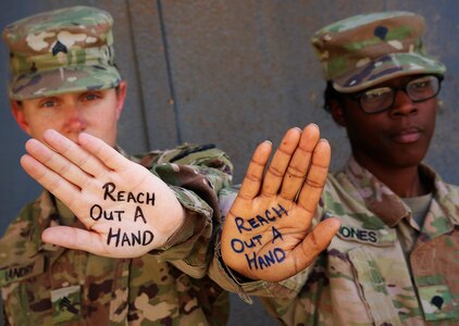 Army Sgt. Rebecca Landry and Spc. Asia Jones highlight the importance of suicide prevention and awareness at Camp Taji, Iraq, June 5, 2019. The National Guard has launched or participated in suicide prevention initiatives throughout 2019. A Department of Defense report released Sept. 26, 2019, underscores the significant challenges the Guard faces in suicide prevention.