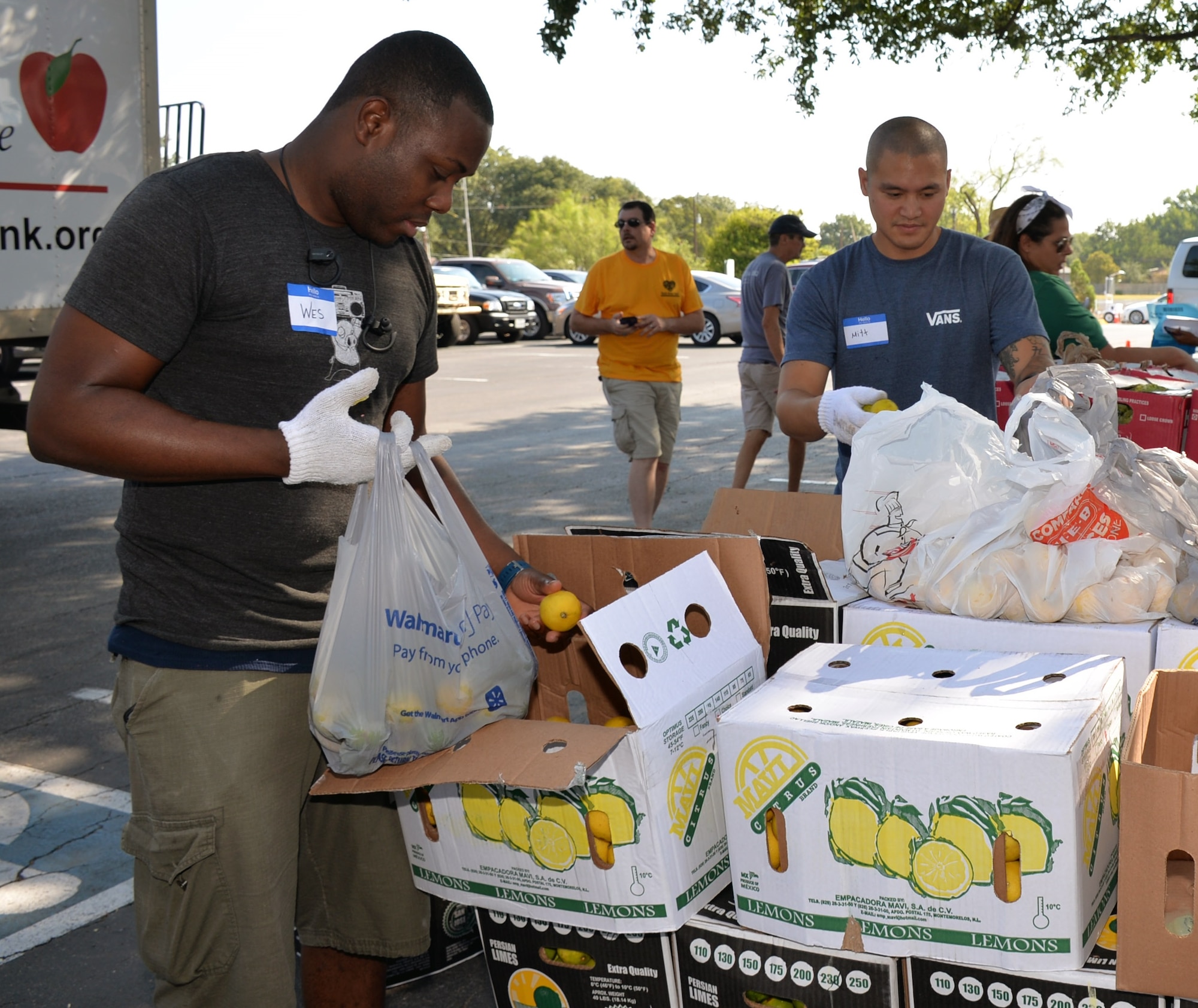 Staff Sgt. Salathiel Wesley, 433rd Maintenance Squadron aerospace ground equipment technician, and Tech. Sgt. Mitt Mekpongsatorn, 433rd Maintenance Group aerospace ground equipment technician, assemble packages of fresh fruit during a San Antonio Food Bank distribution event at Windcrest United Methodist Church Sept. 19. Fifteen Reserve Citizen Airmen from the 433rd Airlift Wing and 960th Cyberspace Wing participated in three distribution events over two days.
