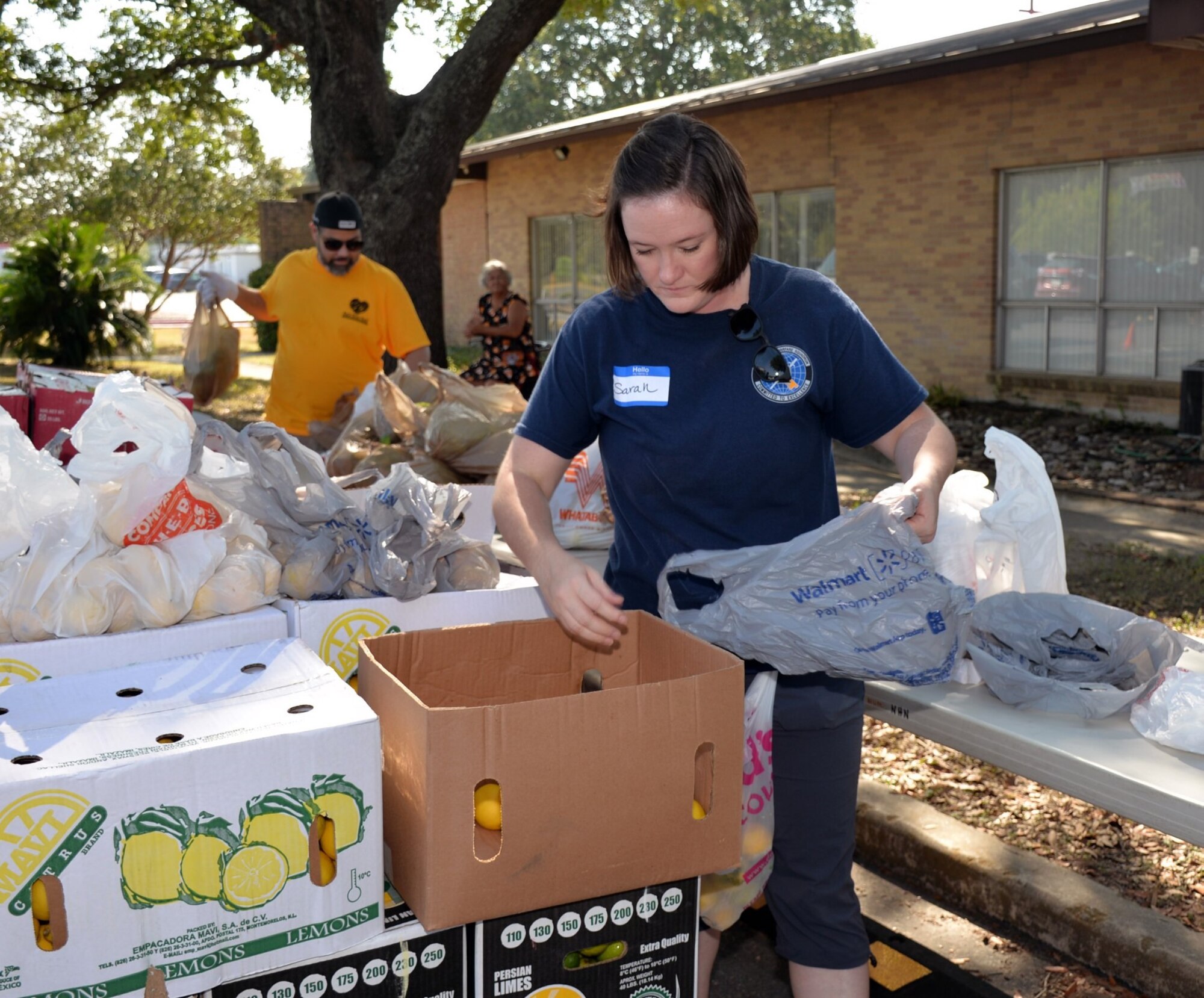 Senior Master Sgt. Sarah Cornelius, 426th Network Warfare Squadron, assembles packages of fresh produce during a San Antonio Food Bank distribution event at Windcrest United Methodist Church Sept. 19. Fifteen Reserve Citizen Airmen from the 433rd Airlift Wing and 960th Cyberspace Wing participated in three distribution events over two days.
