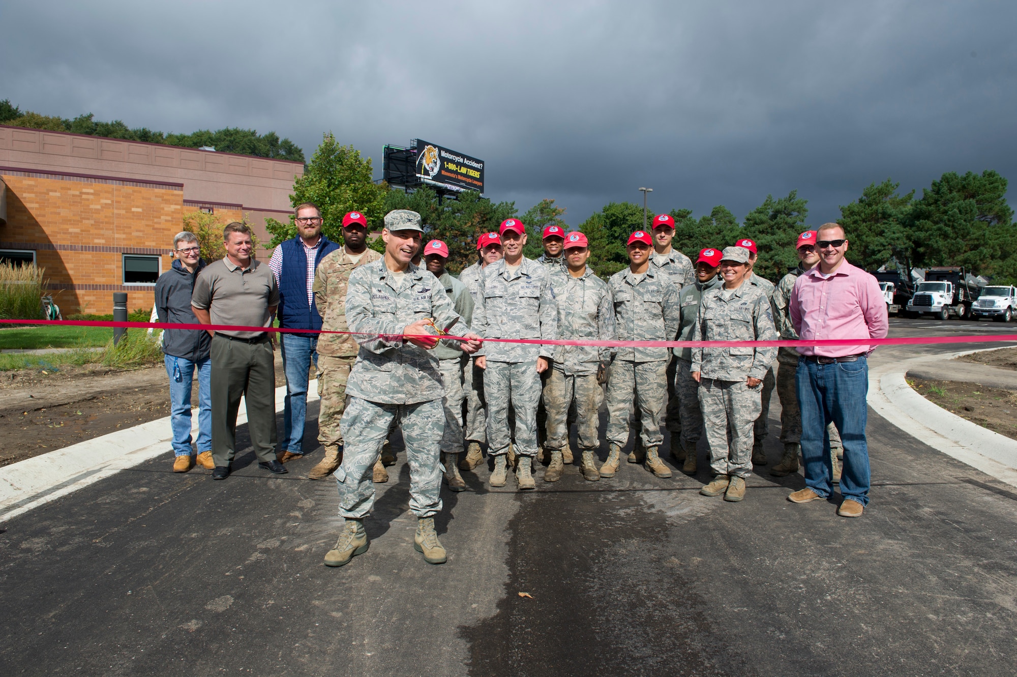 Col. Anthony Polashek, 934th Airlift Wing commander, cut the ceremonial ribbon for the opening of a new perimeter road at the Minneapolis-St. Paul Air Reserve Station, September 13, 2019.  (U.S. Air Force photo by Chris Farley)