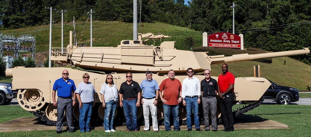 Group standing in front of Abrams tank.