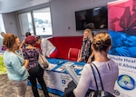 Associates discuss health topics with VA Medical Center vendors during Resiliency Fair, September 25.