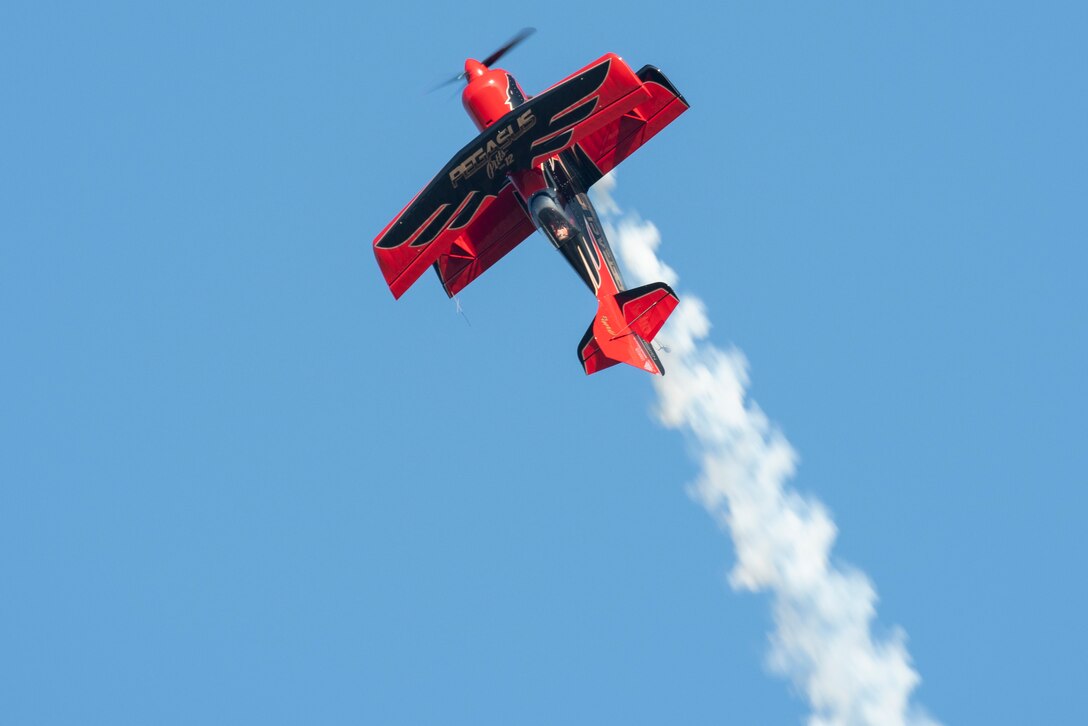 Jeremy Holt pilots his Pitts Model-12 Pegasus aircraft during the Twilight Show before the Defenders of Liberty Air & Space Show at Barksdale Air Force Base, La., May 17, 2019. The airshow was first held in 1933 and is a full weekend of military and civilian aircraft and performances and displays. (U.S. Air Force photo by Senior Airman Maxwell Daigle)