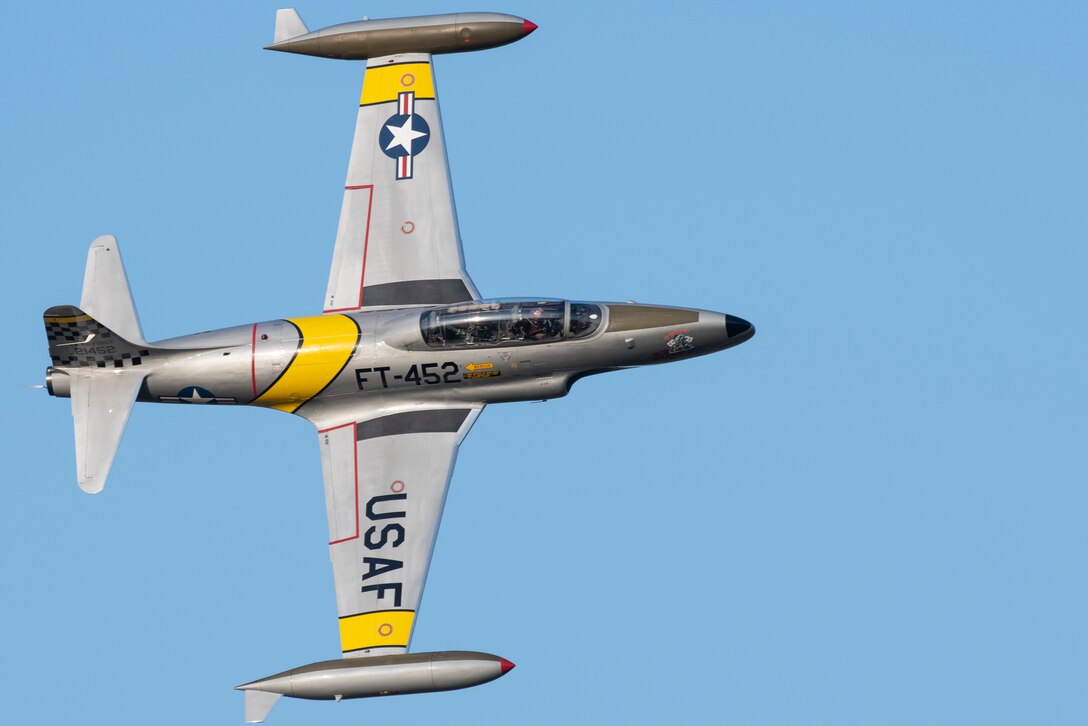 Greg Colyner flies his T-33 Shooting Star trainer jet during the Twilight Show before the Defenders of Liberty Air & Space Show at Barksdale Air Force Base, La., May 17, 2019.The airshow was first held in 1933 and is a full weekend of military and civilian aircraft and performances and displays. (U.S. Air Force photo by Senior Airman Maxwell Daigle)