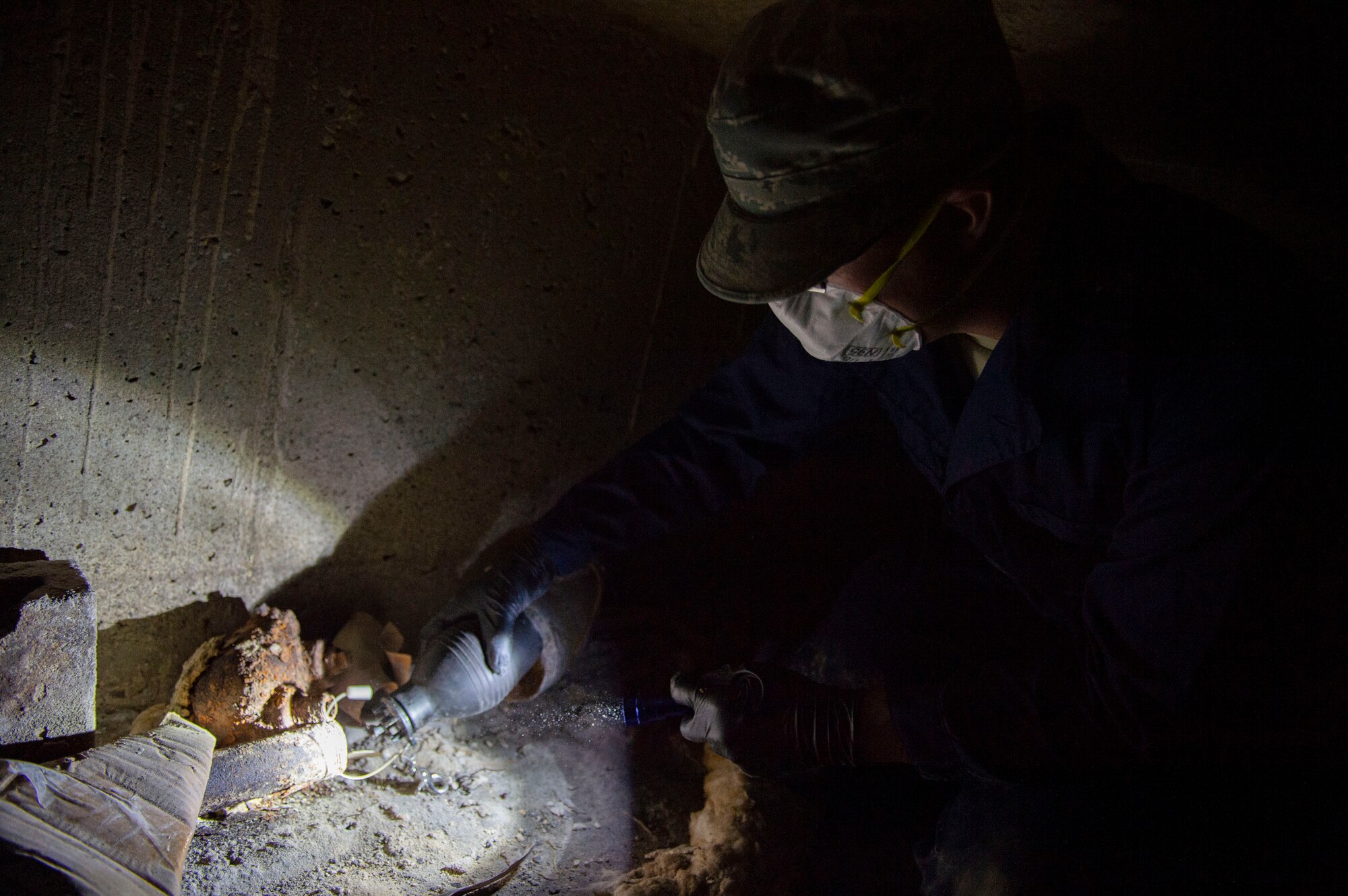 Staff Sgt. Cory Schollmeyer, 23d Civil Engineer Squadron pest management, spreads granular bait underneath a building while conducting a survey treatment Sept. 10, 2019, at Moody Air Force Base, Ga. Pest management, known as entomology, uses survey treatments to keep facilities free of pest-related health hazards, helping Moody’s Airmen stay mission ready. (U.S. Air Force photo by Airman Azaria E. Foster)