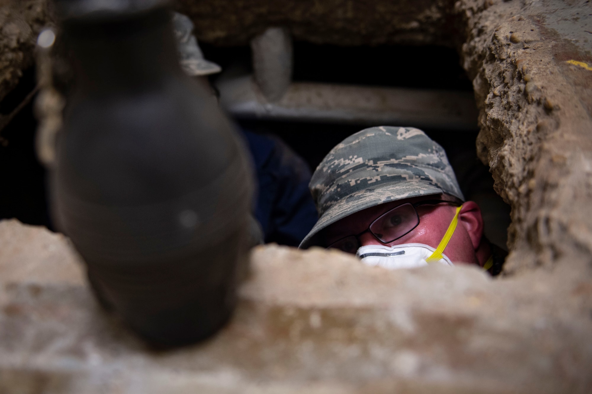 Staff Sgt. Cory Schollmeyer, 23d Civil Engineer Squadron pest management, emerges from underneath a building after conducting a survey treatment Sept. 10, 2019, at Moody Air Force Base, Ga. Pest management, known as entomology, uses survey treatments to keep facilities free of pest-related health hazards, helping Moody’s Airmen stay mission ready. (U.S. Air Force photo by Airman Azaria E. Foster)