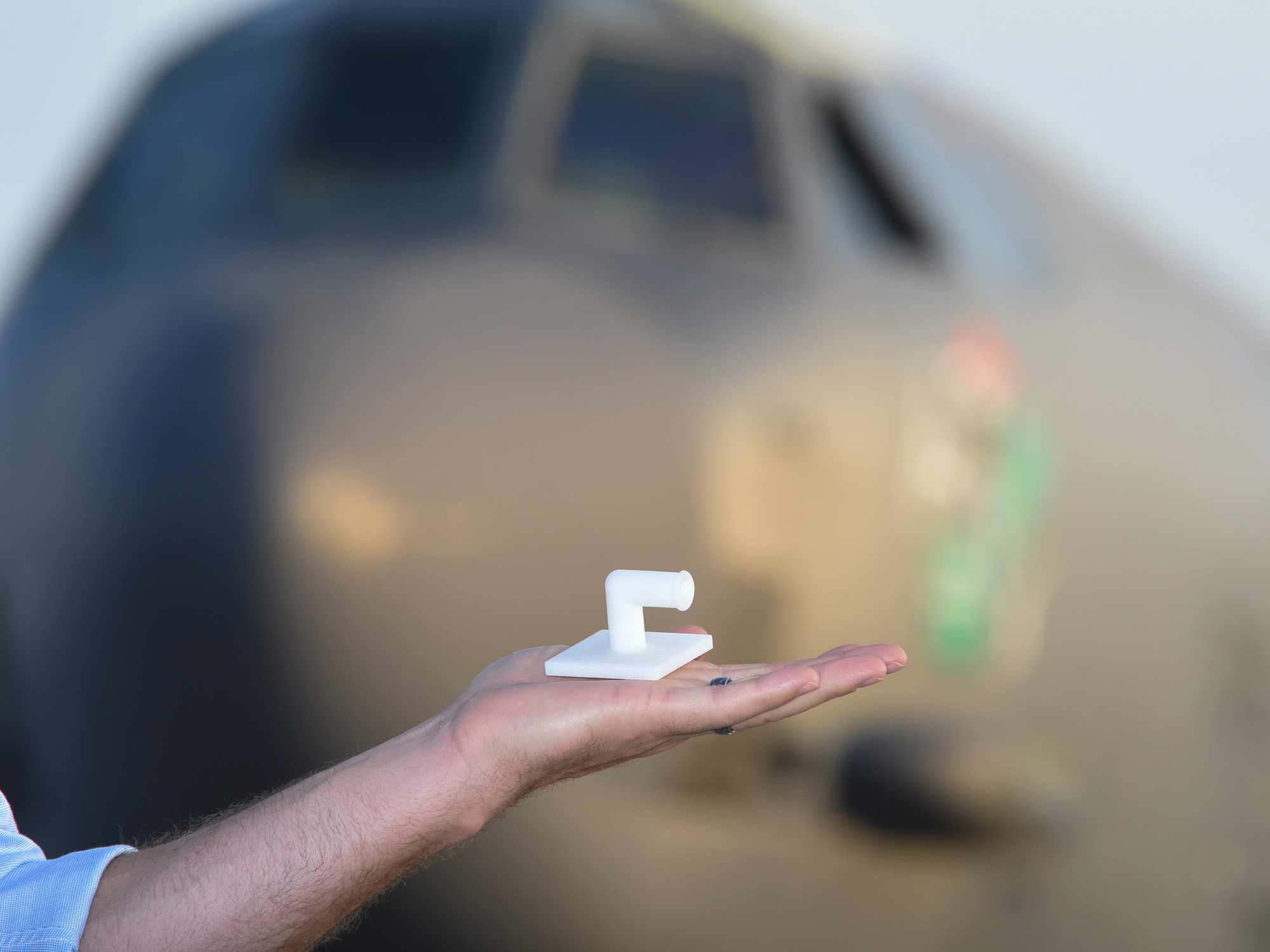 An image of an engineer holding a battery vent tube.