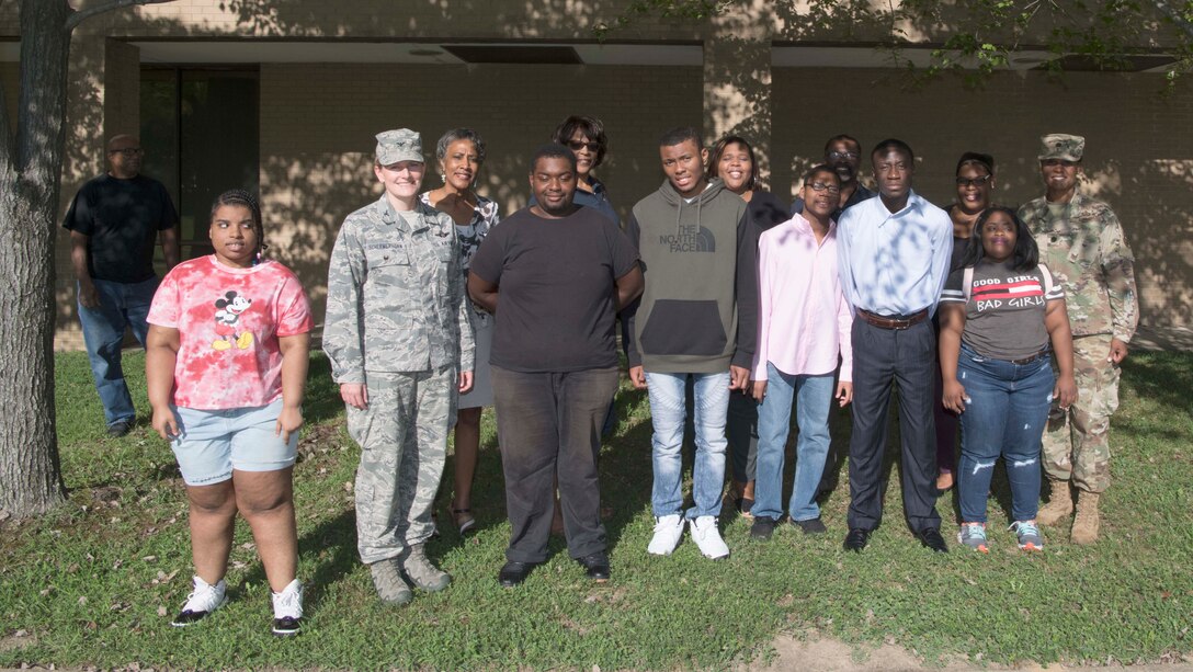 Project Search interns pose for a photo with base officials at Joint Base Andrews, Md., Aug. 29, 2019. The students will work on base on a 10-month long work cycle, rotating through three different job sites, in an effort to develop the employment skills needed for self-determination, management and self-advocacy. (U.S. Air Force photo by Airman 1st Class Spencer J. Slocum)