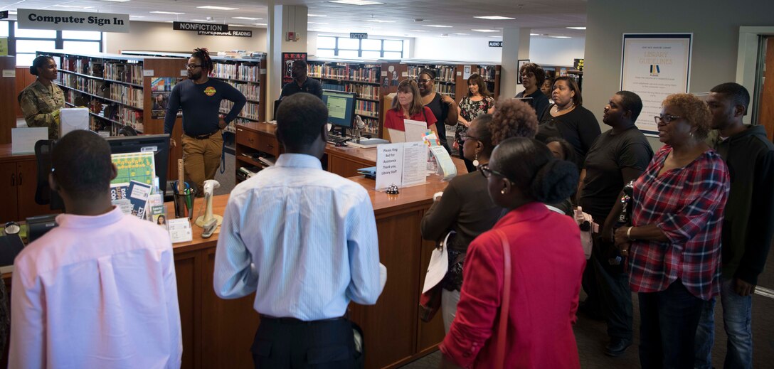 Project Search tour members visit the library at Joint Base Andrews, Md., Aug. 29, 2019. The library is one of many possible work stations interns will have the opportunity to work during their 10-month program on the installation. (U.S. Air Force photo by Airman 1st Class Spencer J. Slocum)