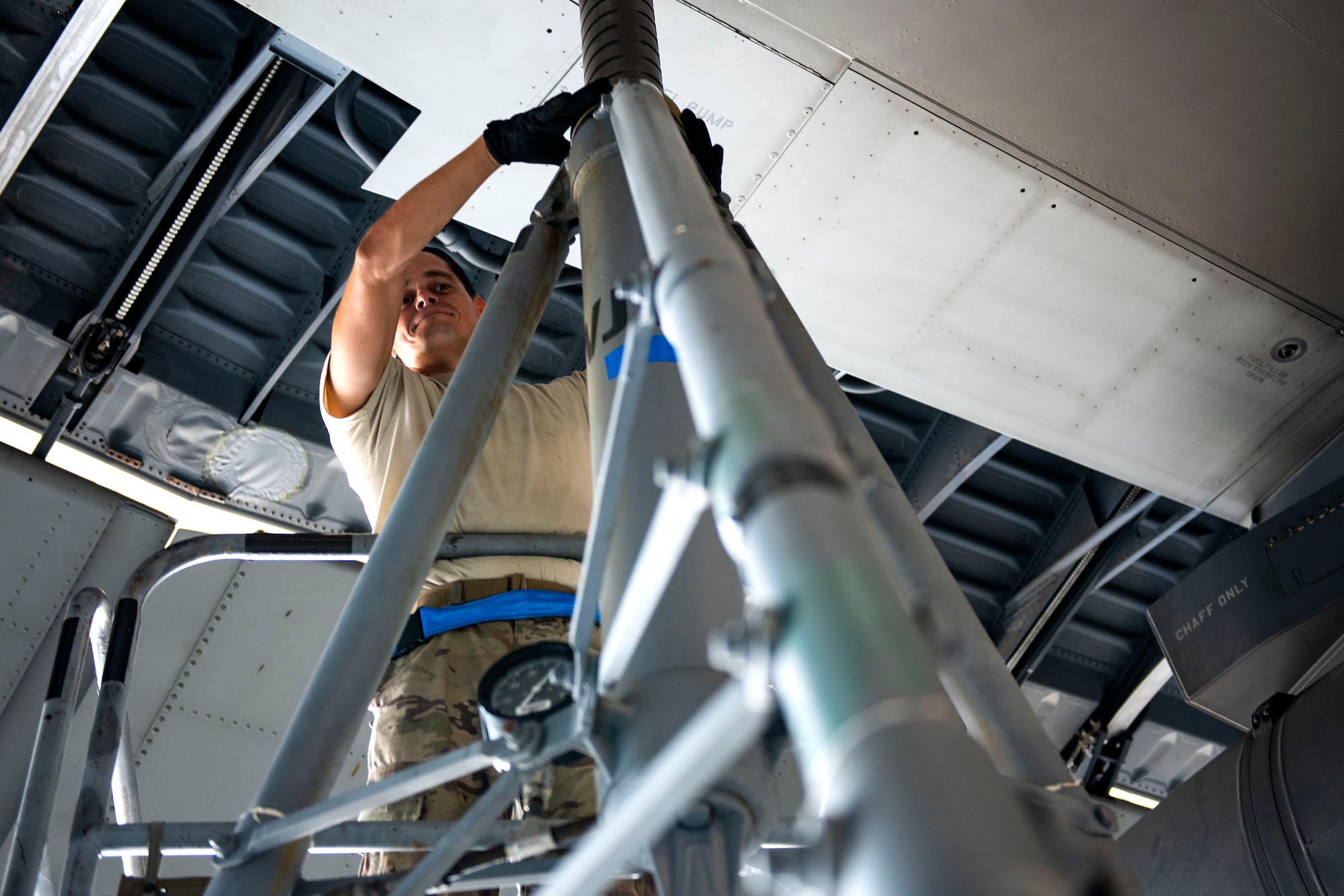 Airman 1st Class Pedro Gerena, 71st Aircraft Maintenance Unit crew chief, checks a ram lock on an aircraft jack during preparation of an HC-130J Combat King II for a situational awareness communication upgrade (SACU) modification Sept. 25, 2019, at Moody Air Force Base, Ga. This SACU will enhance the aircraft’s ability to communicate with personnel on the ground during search and rescue operations. (U.S. Air Force photo by Senior Airman Erick Requadt)