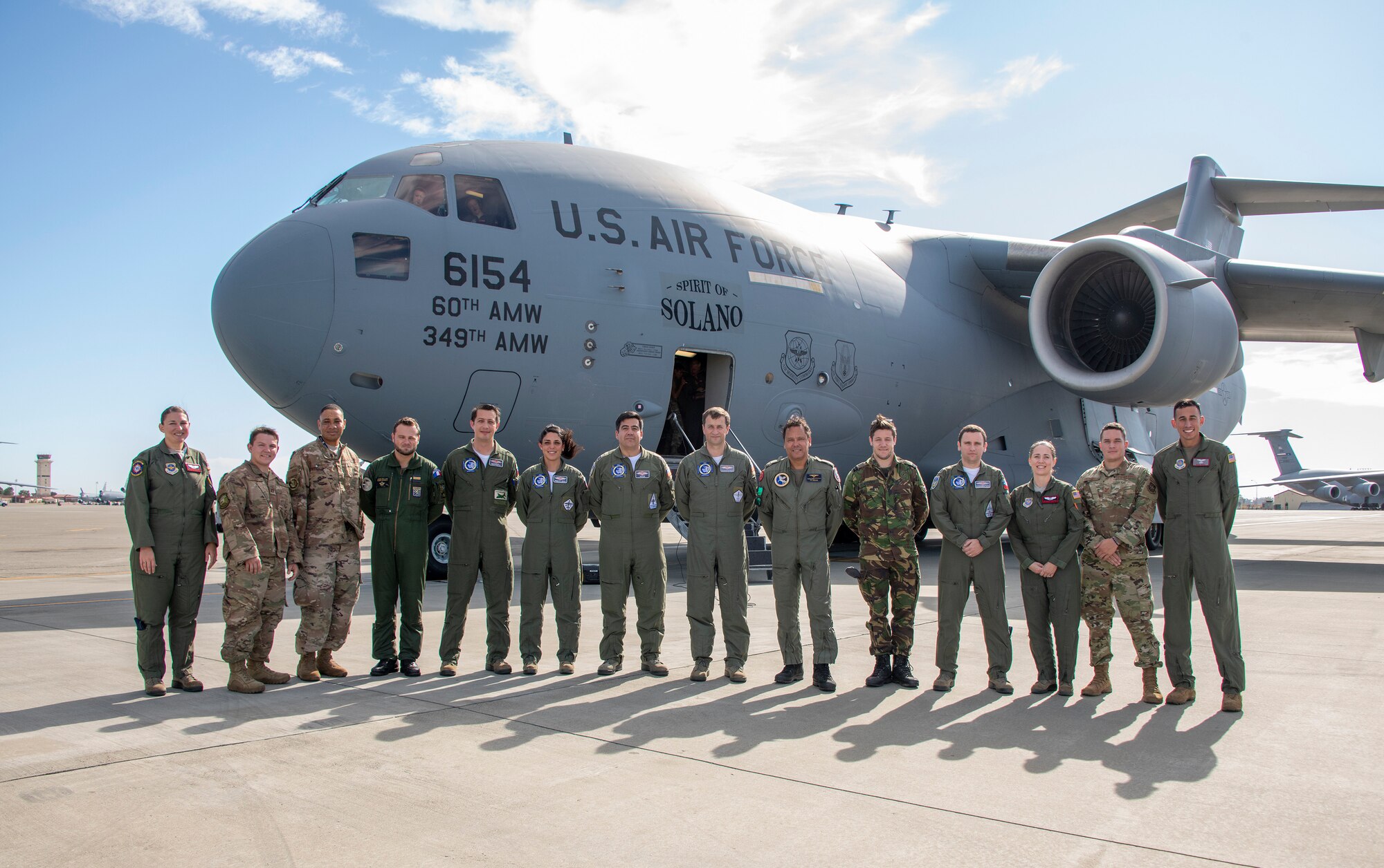 U. S. Air Force and coalition service members stand in front of a C-17 Globe Master III during exercise Mobility Guardian Sept. 25, 2019, at Travis Air Force Base, California. MG19 is Air Mobility Command’s full spectrum readiness exercise, designed to strengthen and improve integrated teamwork. U.S. aircraft joined aircraft from more than two dozen nations along with more than 4,000 U.S. and international Air Force, Army, Navy, and Marine Corps service members. (U.S. Air Force photo by Heide Couch)