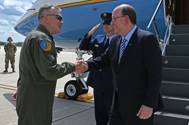 Col. John Pogorek, 157th Air Refueling Wing commander, greets Matthew Donovan, the acting secretary of the Air Force, on the flight line at Pease Air National Guard Base, Aug. 8, 2019. Donovan attended a welcoming event to commemorate the arrival of the new KC-46A air refueling tanker. Pease was the first National Guard Base to receive the plane. (U. S. Air National Guard photo by Staff Sgt. Charles Johnston)