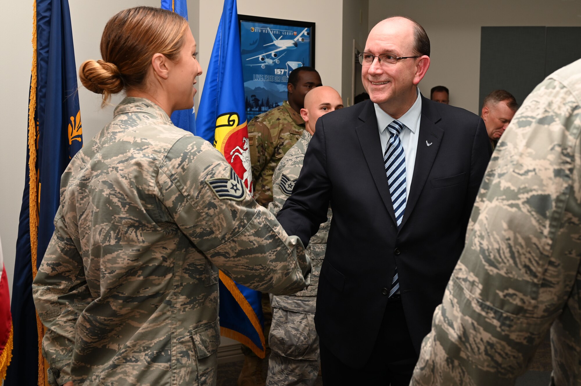 Matthew Donovan, the acting secretary of the Air Force, is greeted by Staff Sgt. Ashley Shipman, an Airmen assigned to the 157th Air Refueling Wing, Pease Air National Guard Base, N.H., Aug. 8, 2019. Donovan attended a welcoming event at the base to commemorate the arrival of the KC-46A air refueling tanker. Pease was the first National Guard Base to receive the new aircraft, which replaced the divested KC-135 Stratotanker. Hundreds of people attended a welcoming event held along the flight line to usher in the new era of aerial refuelers and future generations of Pease Airmen. (U. S. Air National Guard photo by Staff Sgt. Charles Johnston)