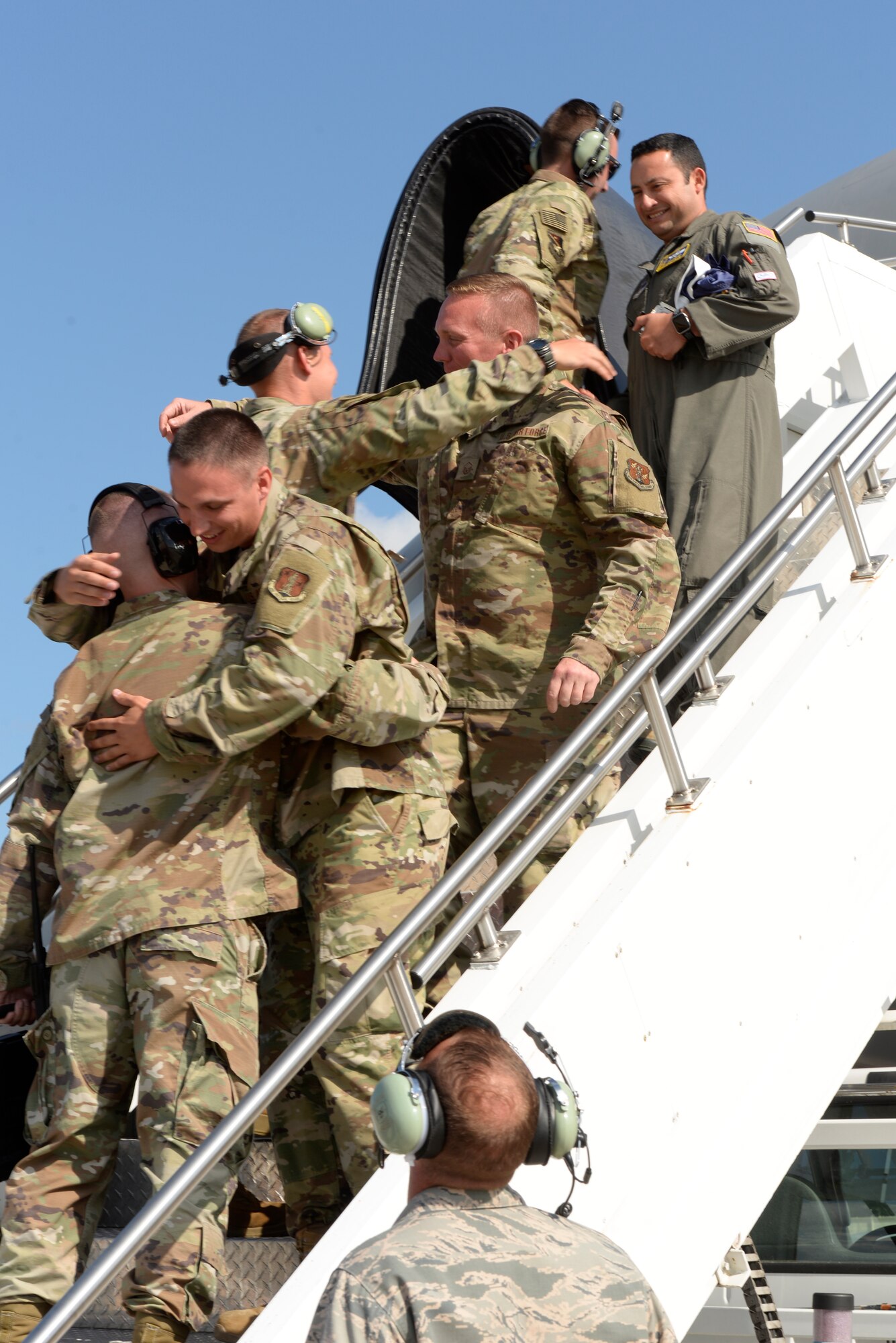 Members from the 157th Maintenance Group celebrate the landing of the first KC-46A Pegasus at Pease Air National Guard Base Aug. 8, 2019. The Pegasus forges a new era at Pease, marking the first upgrade to its aircraft inventory in decades. (U.S. Air National Guard photo by Senior Airman Victoria Nelson)