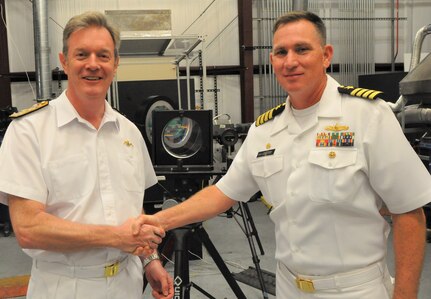 IMAGE: DAHLGREN, Va. (Sept. 25, 2019) - British Royal Navy Second Sea Lord Vice Adm. Nicholas Hine shakes hands with Capt. Casey Plew, Naval Surface Warfare Center Dahlgren Division (NSWCDD) commanding officer, during a presentation held after a live test demonstration. Plew and Hine presented each other with their respective command coins. NSWCDD subject matter experts briefed the second sea lord and his delegation on programs and capabilities that included the NSWCDD Innovation Lab, digitalization of the U.S. Navy, high velocity tactical development, and directed energy weapons such as the high energy laser, electromagnetic railgun and hyper-velocity projectile.  (U.S. Navy photo/Released)