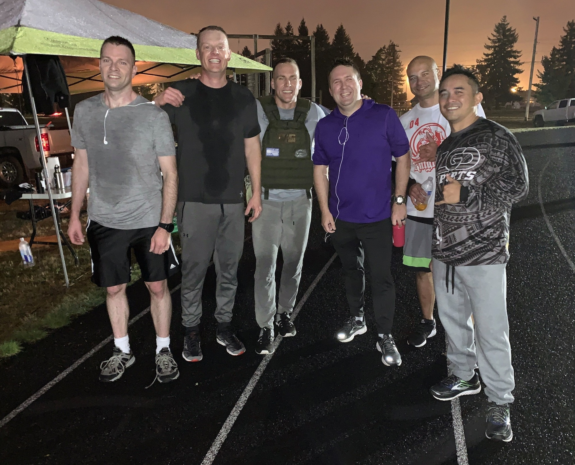 Members of the 225th Air Defense Squadron, lead by their commander Col. Brian Bergren (second from left), finished running about seven miles each during the POW/MIA Remembrance Run on Joint Base Lewis-McChord Sept. 19, 2019. (Courtesy photo)