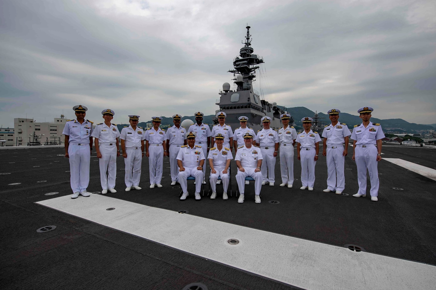SASEBO, Japan (Sept. 26, 2019) Indian Navy Rear Adm. Suraj Berry, NM, VSM, Commander, Eastern Fleet; Japan Maritime Self-Defense Force Rear Adm. Masafumi Nishiwaki, Commander, Escort Flotilla Four; and Rear Adm. Jimmy Pitts, Commander Submarine Group 7 join a multinational group of sailors for a photo during the MALABAR 2019 opening ceremony. Malabar is an annual multinational maritime exercise started in 1992 with the U.S. and Indian navies and most recently including the JMSDF, to increase cooperation among allied and partner nations in the Indo Pacific.