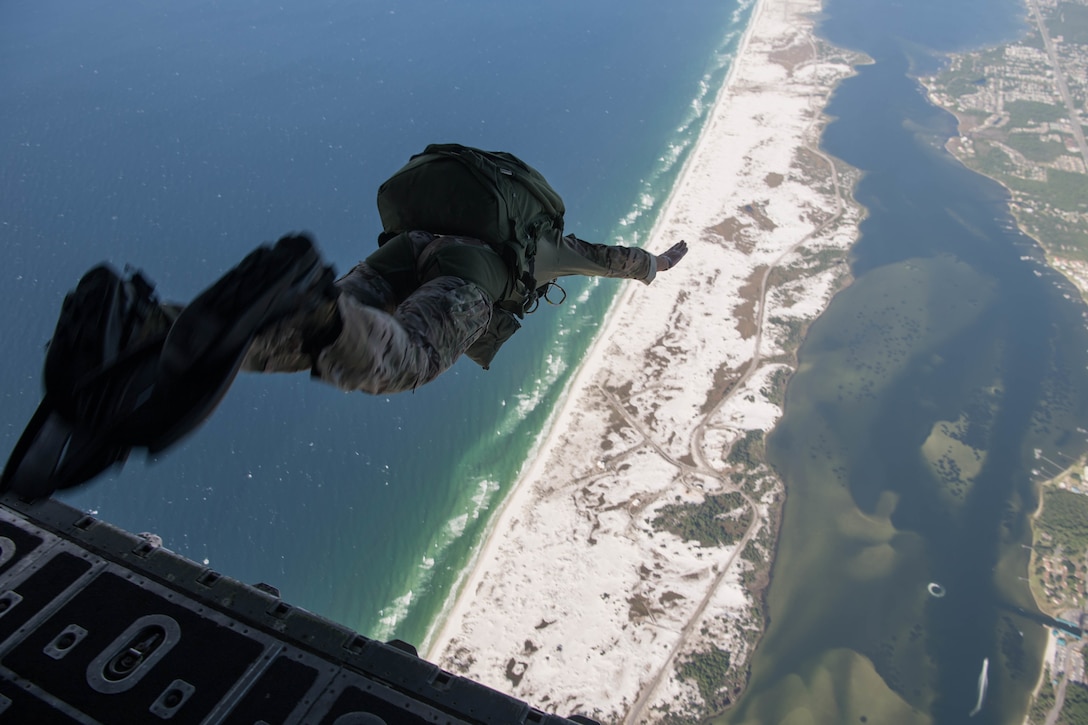 Col. exits an MC-130H Combat Talon II during his final military free-fall jump