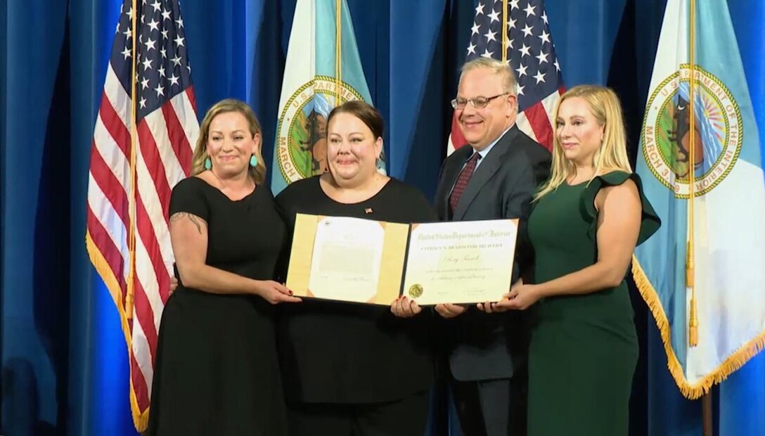 On his behalf, Rory Farrell’s family accepted the U.S. Department of the Interior Citizen’s Award for Bravery Sept. 12, 2019, in Washington, D.C. Pictured from left to right, Candace Farrell, Megin Farrell, Secretary of the Department of Interior David L. Bernhardt, and Alexandra McGrath. (Courtesy photo)