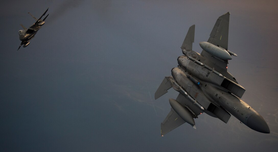 U.S. Air Force F-15C Eagles break away during a combat air patrol within the U.S. Central Command area of responsibility, June 2, 2019. The F-15 plays an integral role in shaping the battle space of ongoing operations, working hand-in-hand with joint, international and interagency partners, providing stability in the region by deterring current and emerging threats. (U.S. Air Force photo by Staff Sgt. Keifer Bowes)