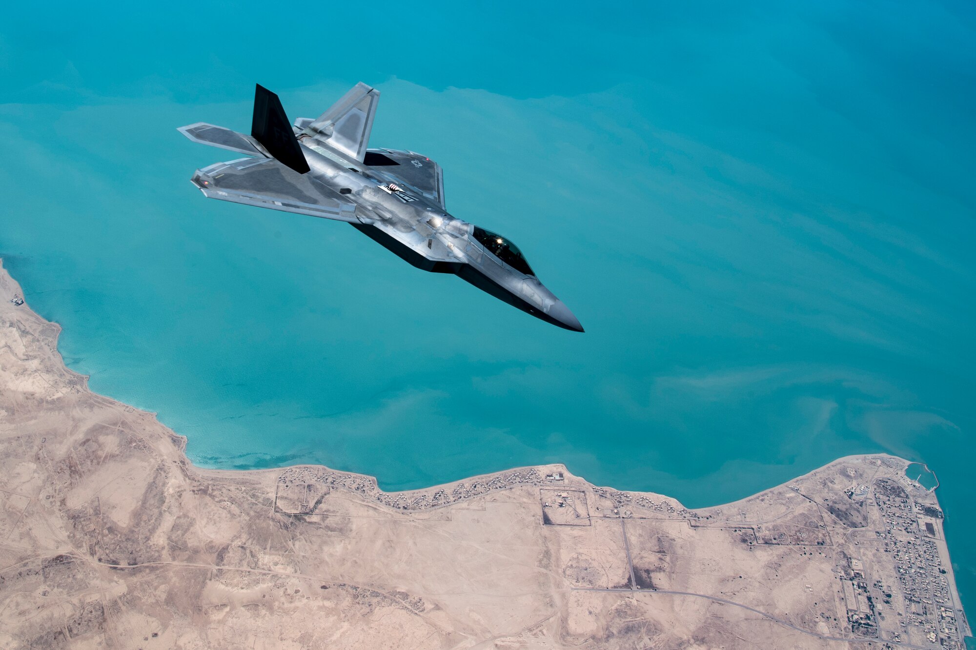 A U.S. F-22 Raptor conducts a combat air patrol mission over an undisclosed location in Southwest Asia, Sept. 13, 2019. The F-22, a critical component of the Global Strike Task Force, is designed to project air dominance, rapidly and at great distances and defeat threats attempting to deny access to our nation's Air Force, Army, Navy and Marine Corps. The F-22 cannot be matched by any known or projected fighter aircraft. (U.S. Air Force photo by Master Sgt. Russ Scalf)