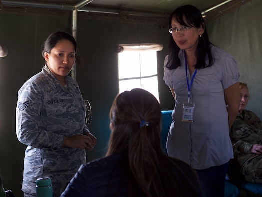 U.S. Air Force Senior Airman Liana Chythlook, assigned to the 176th Medical Group, Alaska Air National Guard, and Mongolian translator, N. Gantuya, explain a medical scenario Sept. 20, 2019, during Gobi Wolf 2019 in Sainshand, Mongolia. GW 19 was hosted by the Mongolian National Emergency Management Agency and Mongolian Armed Forces as part of the United States Army Pacific's humanitarian assistance and disaster relief "Pacific Resilience" series. (U.S. Air National Guard photo by David Bedard/Released)