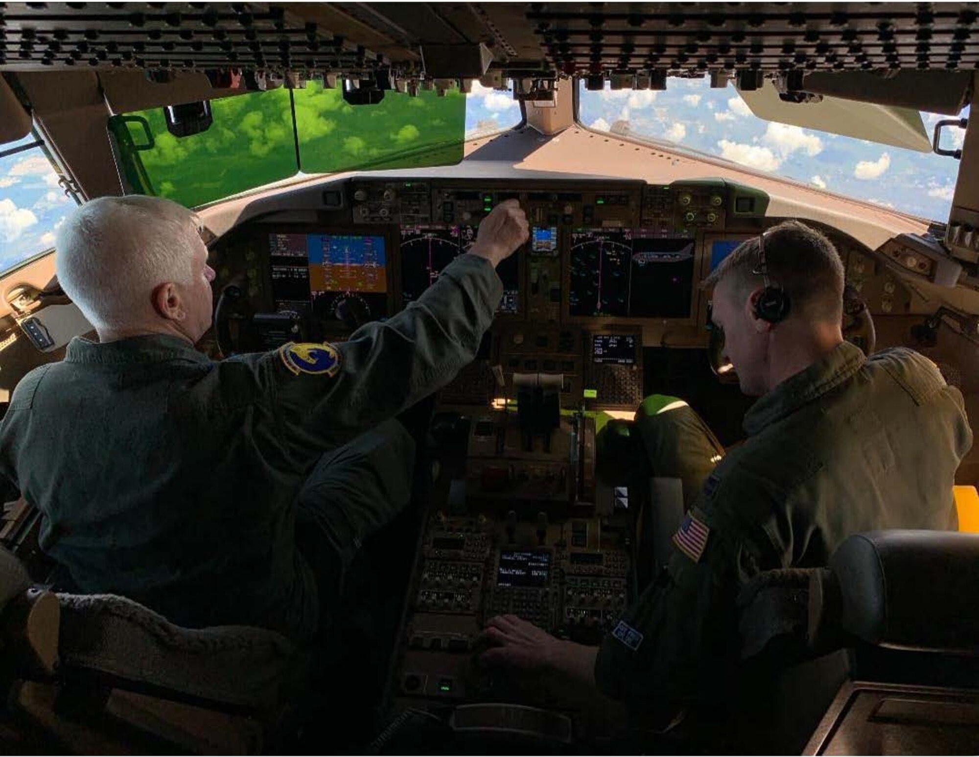 U.S. Air Force Lt. Gen. L. Scott Rice, left, director of the Air National Guard, and U.S. Air Force Capt. Lee
Rice, right, a pilot assigned to the 157th Air Refueling Wing, Pease Air National Guard Base, New
Hampshire, fly a KC-46A Pegasus Aug. 8, 2019. This KC-46 was flown by the Rice father-and-son duo to
the aircraft’s newly assigned home station at the 157th ARW. (U.S. Air National Guard photo by Staff
Sgt. Morgan R. Lipinski)