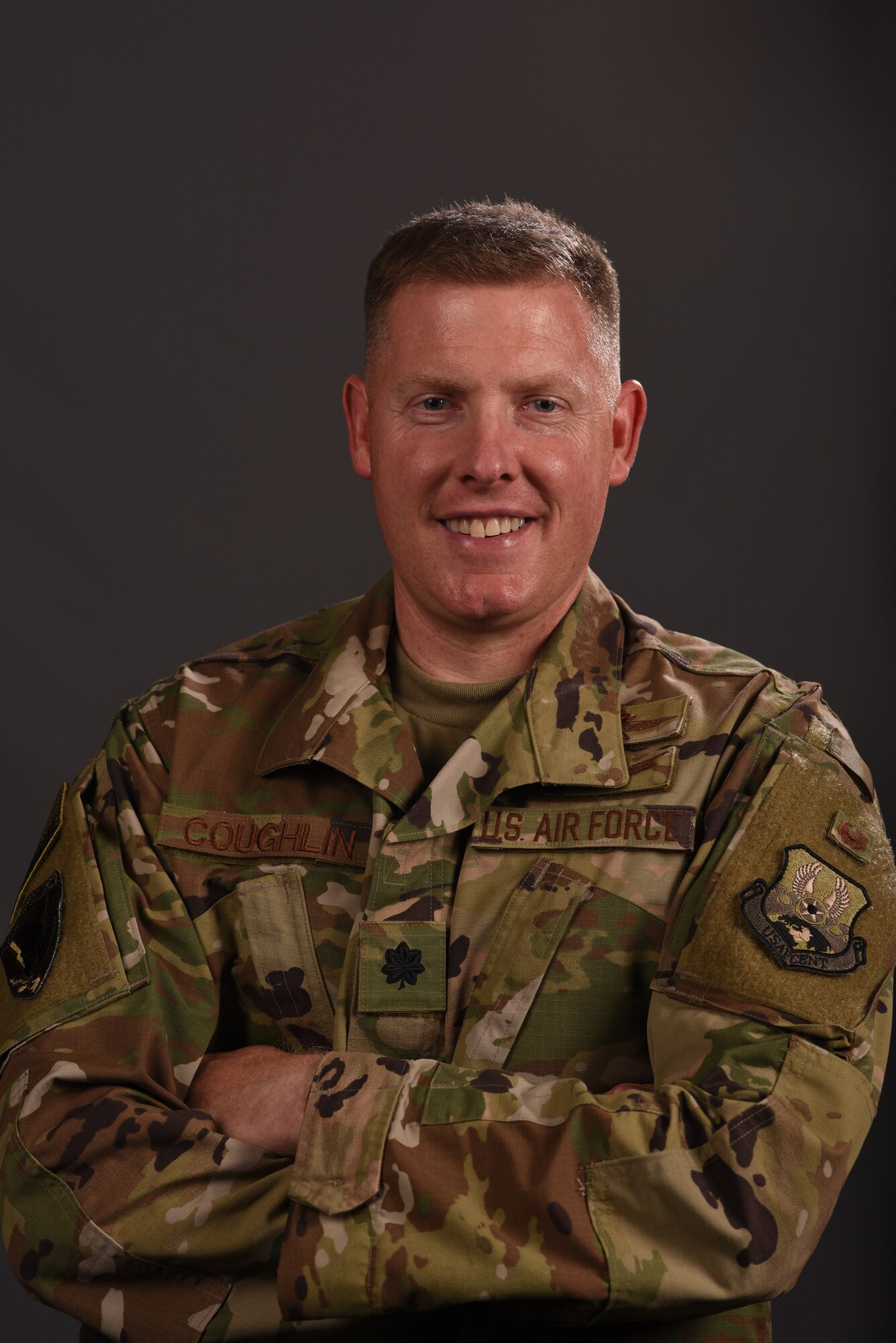 Lt. Col. Coughlin, United Sates Air Forces Central Command director of communications, smiles while in uniform, at Shaw Air Force Base, South Carolina, Aug. 20, 2019.