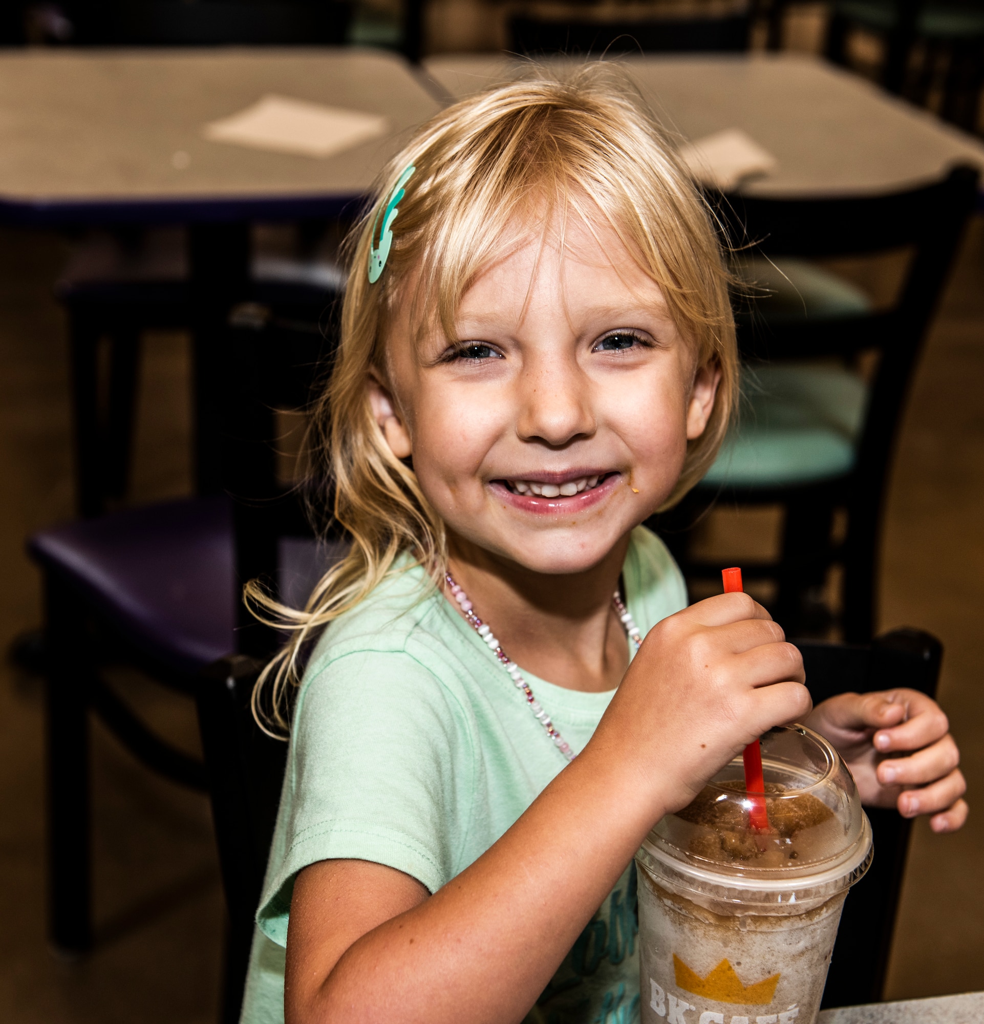 Lily, daughter of Lt. Col. Jim Coughlin, drinks a milkshake after mass at Shaw Air Force Base, S.C. Sept. 09, 2019.