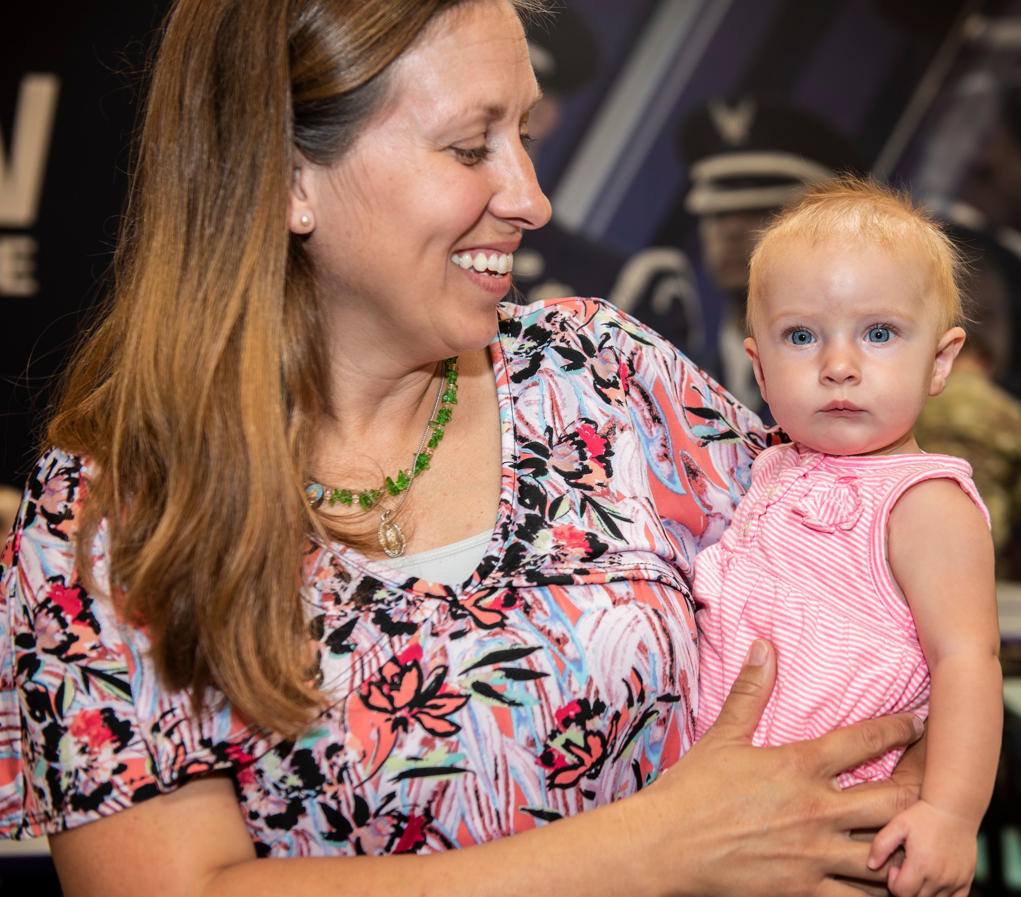 Erin Coughlin, wife of Lt. Col. Jim Coughlin, smiles at her youngest daughter at Shaw Air Force Base, South Carolina, Sept. 8, 2019.