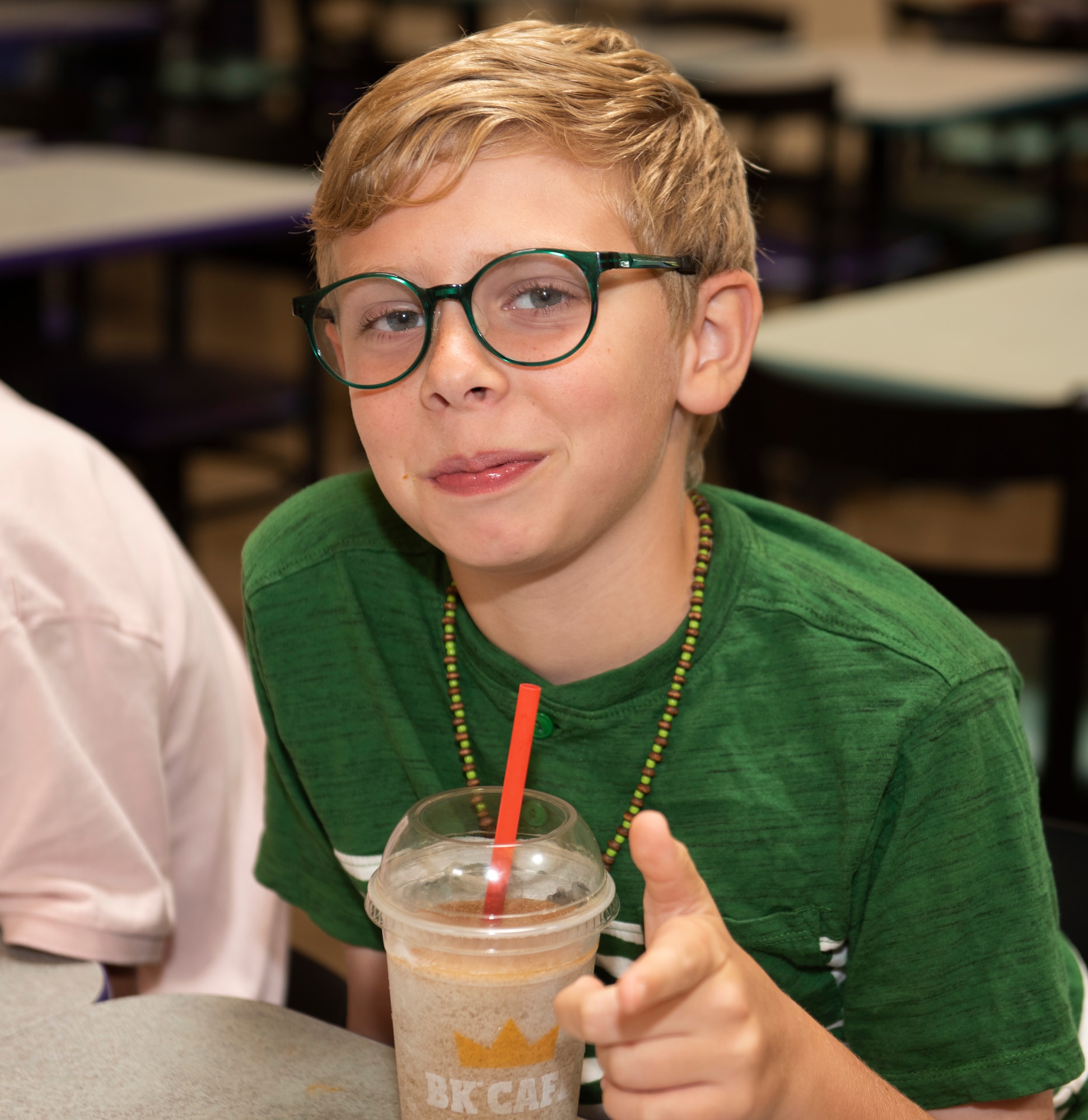 Eli, son of Lt. Col. Jim Coughlin, grins as he has lunch with his family at Shaw Air Force Base, Sept. 8, 2019.