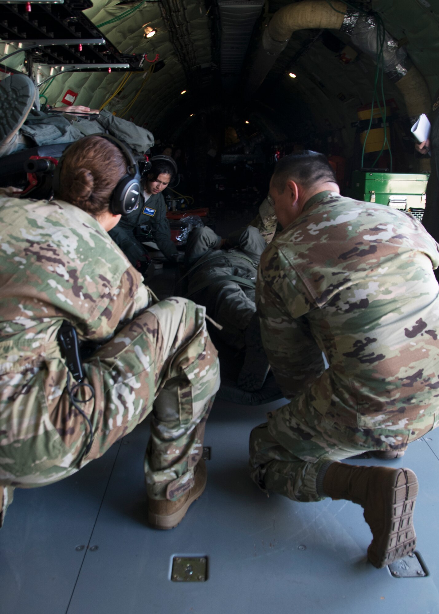 Members of the 459th Aeromedical Evacuation Squadron prepare to place a patient onto a Stanchion Litter System in preparation for an off station trainer Sept. 20, 2019 at Joint Base Andrews, Md. The team participates in local and off station training missions about twice a month to ensure humanitarian and deployment mission readiness. (U.S. Air Force photo by Staff Sgt. Cierra Presentado/Released)