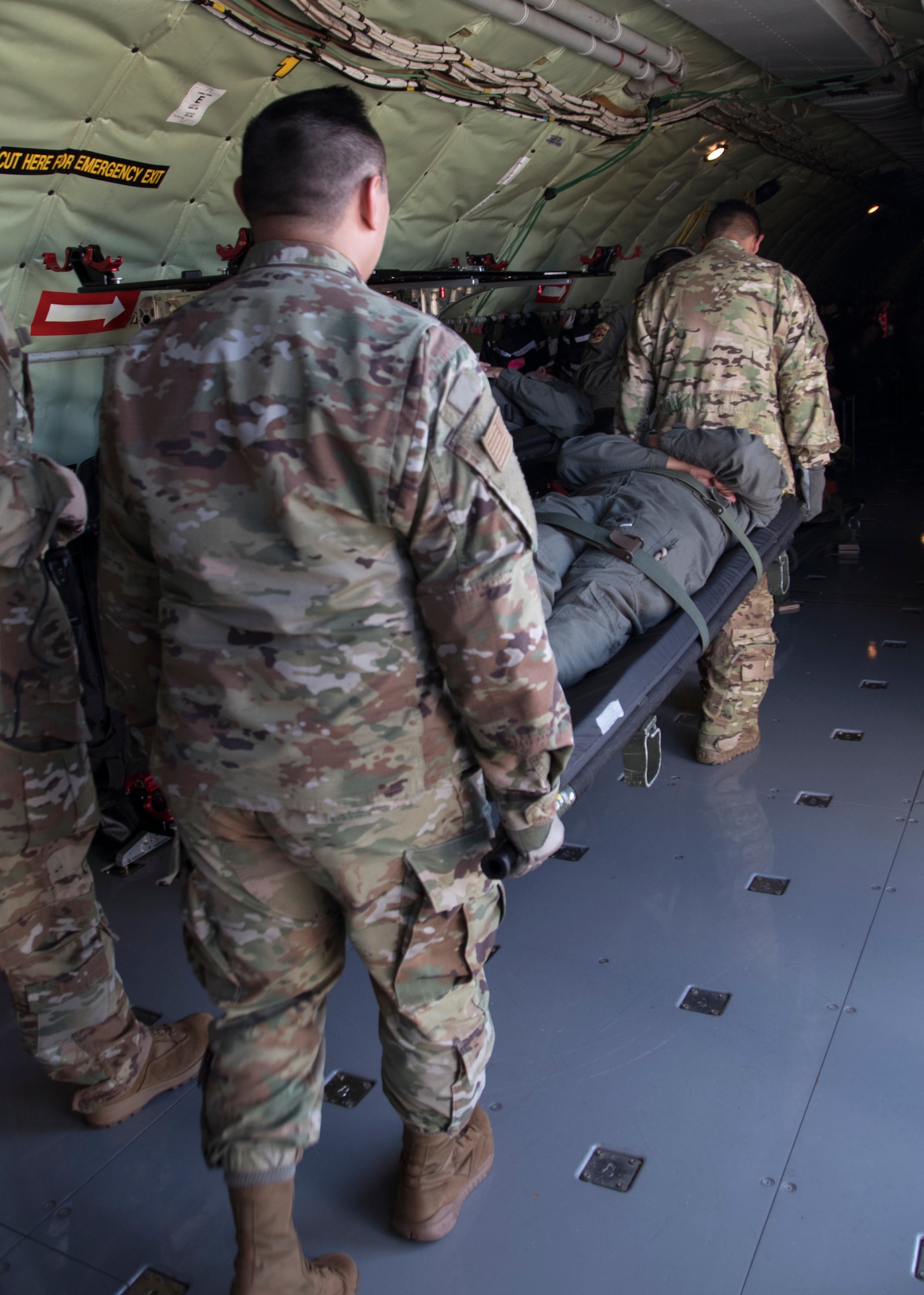 Members of the 459th Aeromedical Evacuation Squadron carry a patient onto a KC-135 Stratotanker in preparation for an off station trainer, Sept. 20, 2019 at Joint Base Andrews, Md. The team conducted the training on the way to Wright Patterson Air Force Base, Ohio, where they also ran in the Air Force Marathon. (U.S. Air Force photo by Staff Sgt. Cierra Presentado/Released)