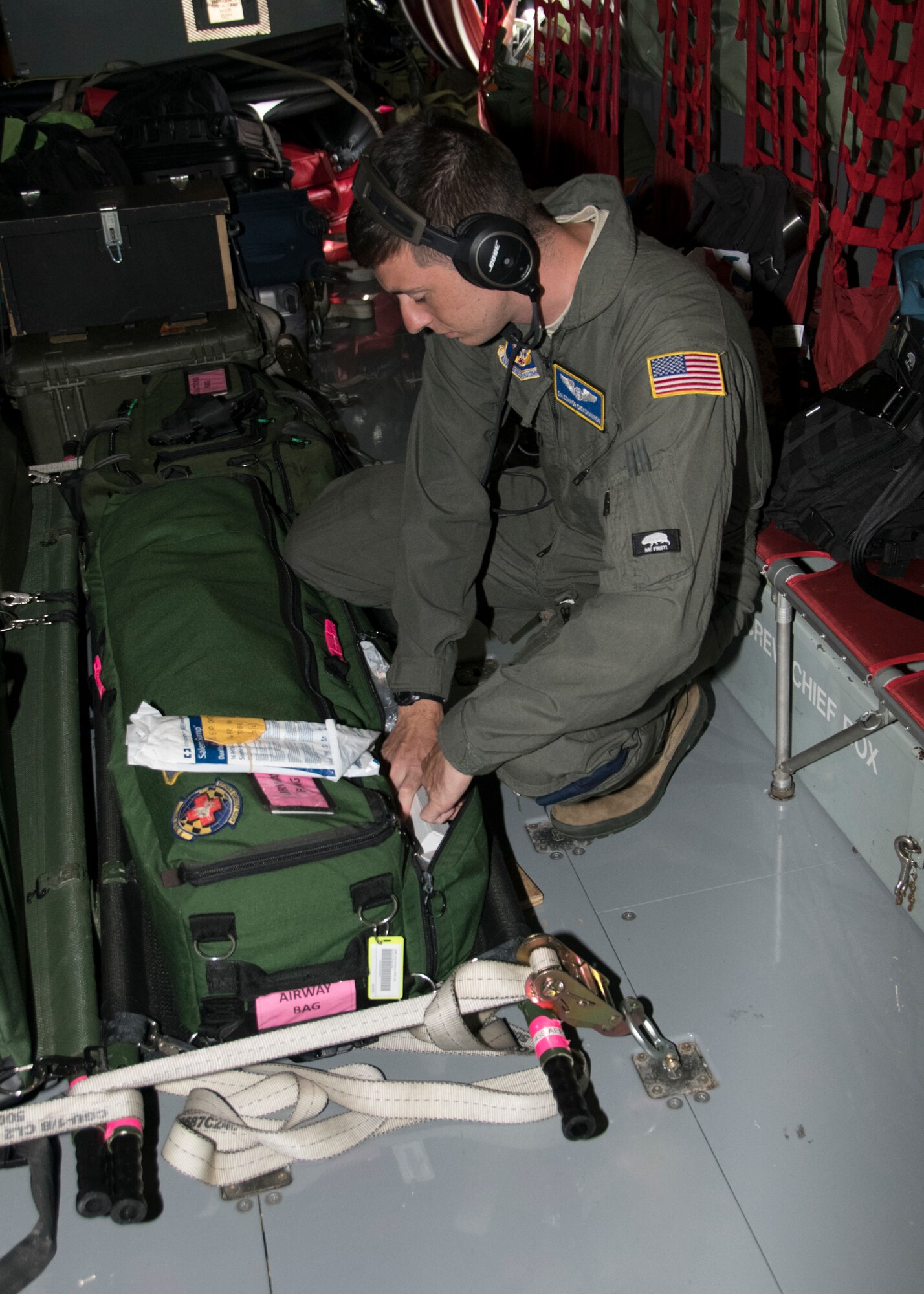 Senior Airman Connor Dick-Shannon, 459th Aeromedical Evacuation Squadron flight medic, gathers medical supplies during an off station trainer on a KC-135 Stratotanker, Sept. 20, 2019. The team participates in local and off station training missions about twice a month to ensure humanitarian and deployment mission readiness. (U.S. Air Force photo by Staff Sgt. Cierra Presentado/Released)