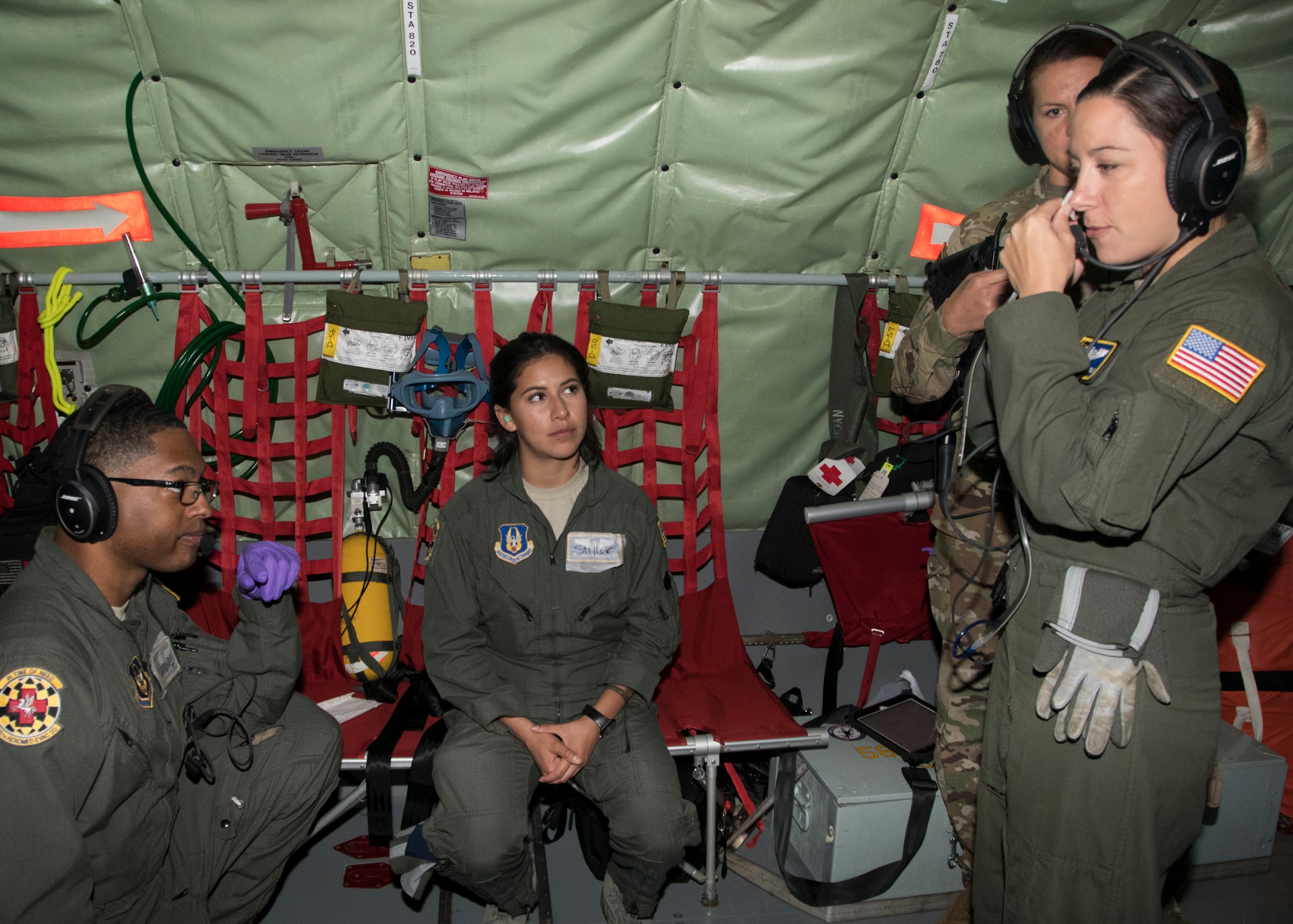 Master Sgt. Kat Hamblin, 459th Aeromedical Evacuation Squadron flight instructor, demonstrates how to properly measure a nasal gastric tube during an off station trainer on a KC-135 Stratotanker Sept. 20, 2019. The team participates in local and off station training missions about twice a month to ensure humanitarian and deployment mission readiness. (U.S. Air Force photo by Staff Sgt. Cierra Presentado/Released)