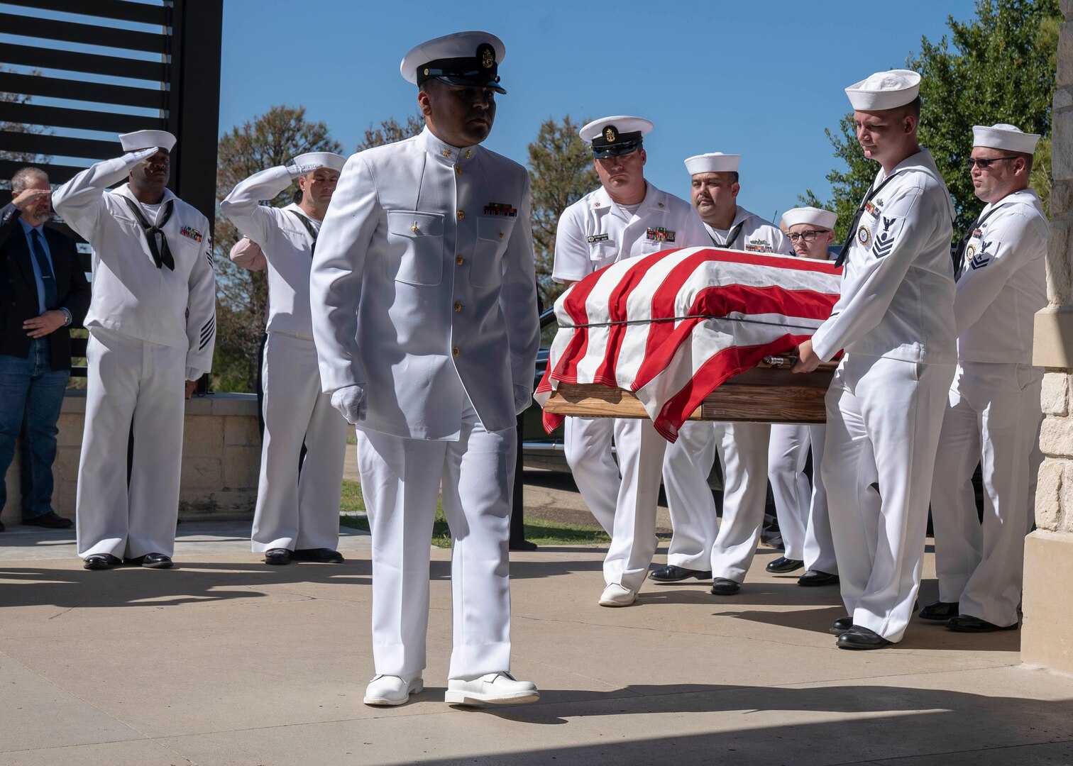 Navy Recruiting District San Antonio Sailors carry the casket for Petty Officer 3rd Class Mark Lyle Walker, a sonar technician (submarine), in Killeen, Texas, Sept. 26 . Walker, a submarine veteran, had no family or next of kin, prompting the Navy Medicine Education, Training and Logistics Command, Navy Medicine Training Support Center and NRD-SA Sailors to make the two-hour drive from Joint Base San Antonio to honor Walker's Navy service.