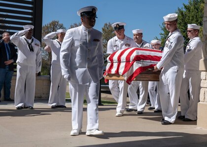 Navy Recruiting District San Antonio Sailors carry the casket for Petty Officer 3rd Class Mark Lyle Walker, a sonar technician (submarine), in Killeen, Texas, Sept. 26 . Walker, a submarine veteran, had no family or next of kin, prompting the Navy Medicine Education, Training and Logistics Command, Navy Medicine Training Support Center and NRD-SA Sailors to make the two-hour drive from Joint Base San Antonio to honor Walker's Navy service.