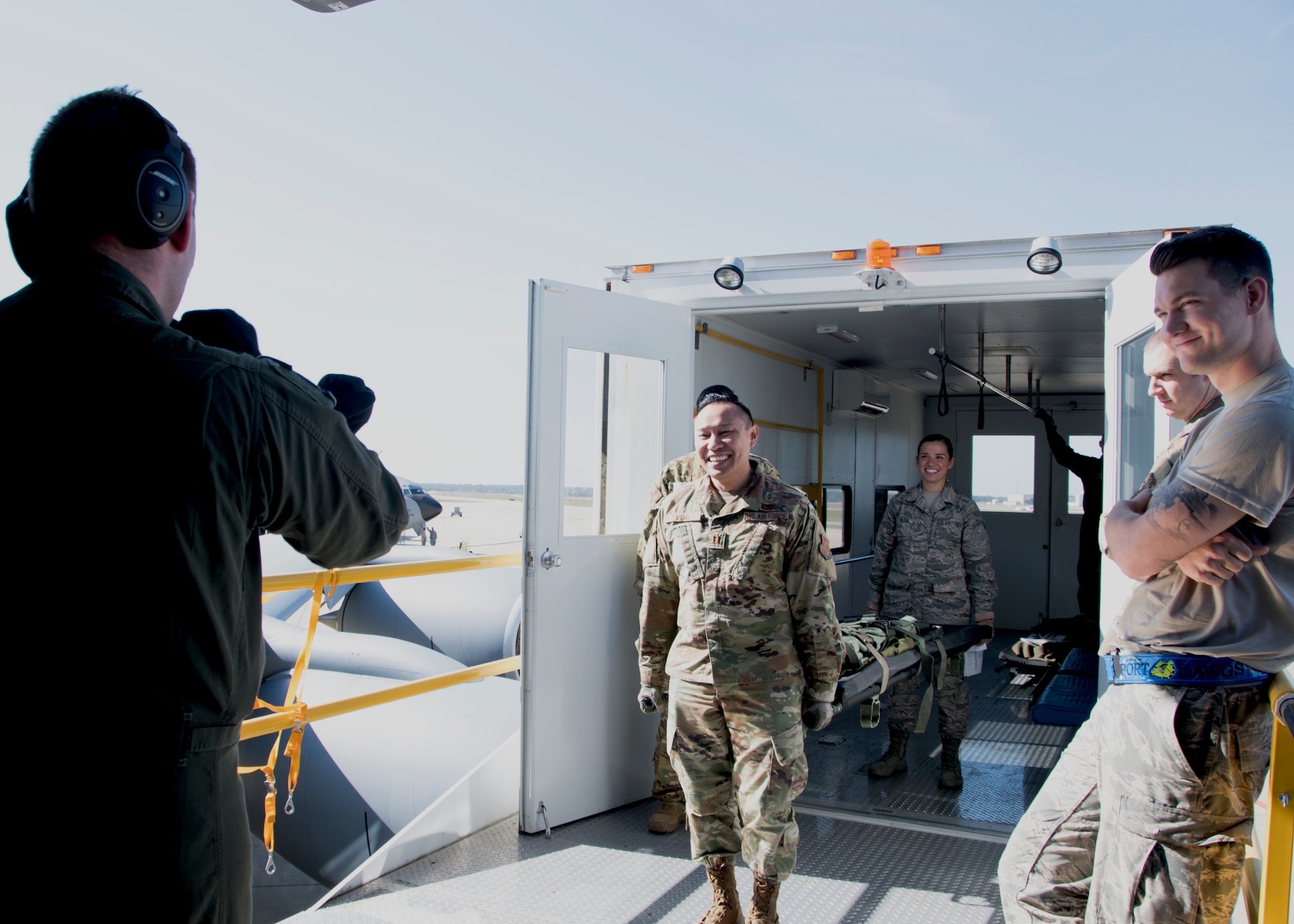 Capt. Francisco Vidal, 459th Aeromedical Evacuation Squadron medical services corps officer and Senior Airman Hilary Bliss, 459 AES squadron aviation resource manager, carry a patient onto a KC-135 Stratotanker in preparation for an off station trainer Sept. 20, 2019, at Joint Base Andrews, Md. The team participates in local and off station training missions about twice a month to ensure humanitarian and deployment mission readiness. (U.S. Air Force photo by Staff Sgt. Cierra Presentado/Released)