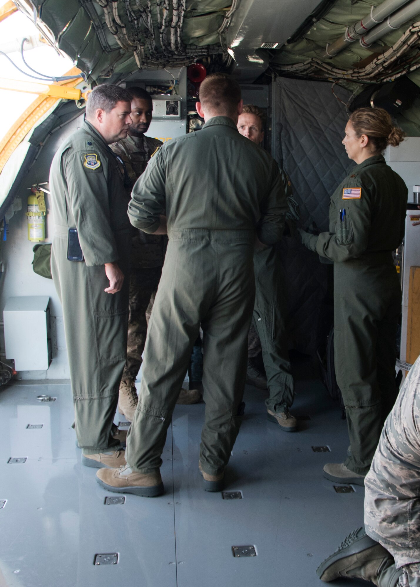 Maj. Kristina George, 459 Aeromedical Evacuation Squadron flight nurse examiner (right), evaluates Capt. Joseph Dabbs, medical crew director, during a pilot brief prior to taking off for an off station trainer on a KC-135 Stratotanker, Sept. 20, 2019 at Joint Base Andrews, Md. The AES team participates in local and off station training missions about twice a month to ensure humanitarian and deployment mission readiness. (U.S. Air Force photo by Staff Sgt. Cierra Presentado/Released)