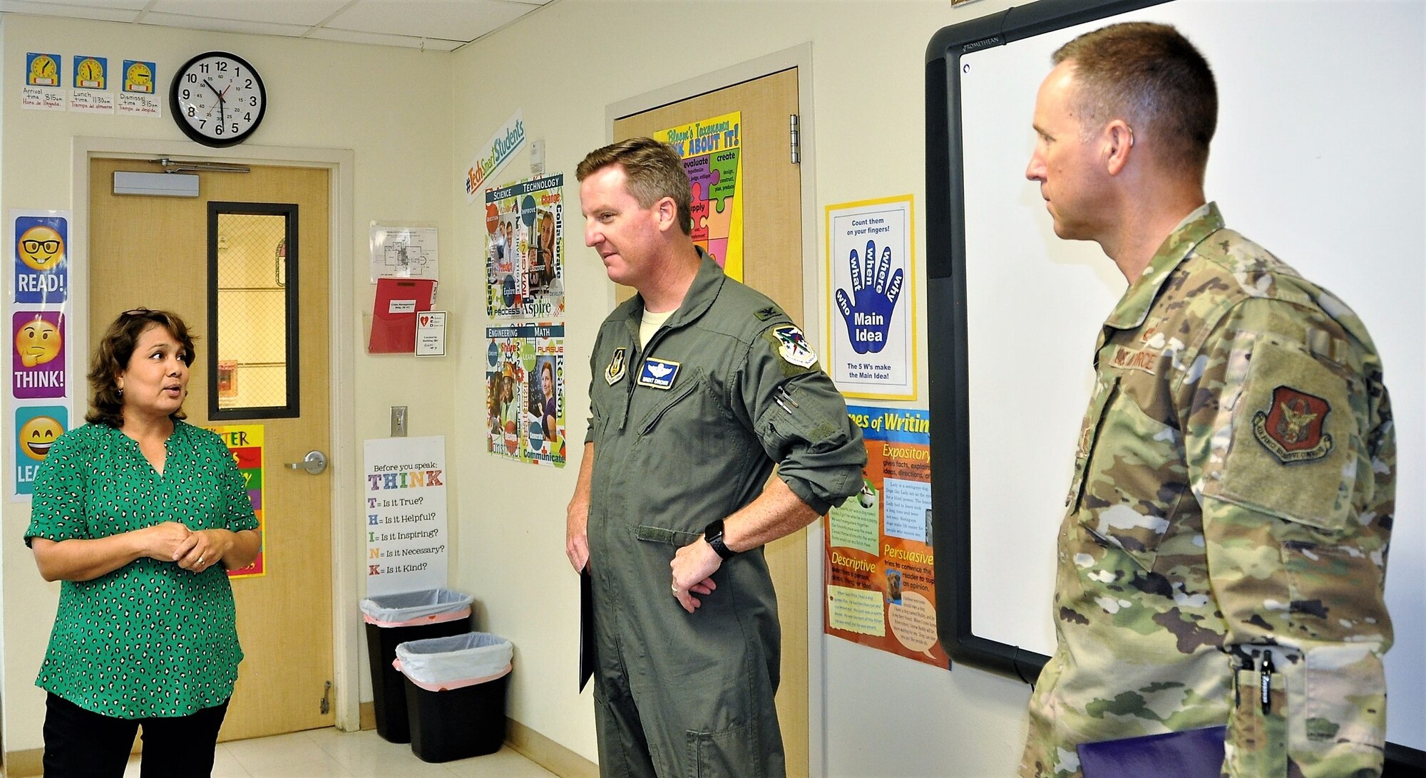 Mary Jane Garcia, an elementary school teacher at the San Antonio, Texas Family Violence Prevention Services/Battered Women and Children’s Shelter, explains the educational structure she devised to ensure children receive grade-specific instruction while they are at the shelter to Col. Brent Drown, 340th Flying Training Group deputy commander and Chief Master Sgt. Scott Goetze, group superintendent, during a classroom tour of the BWCS Aug. 27 prior to the group's Sept. 11 outreach event at the shelter donation center. (U.S. Air Force photo by Janis El Shabazz)