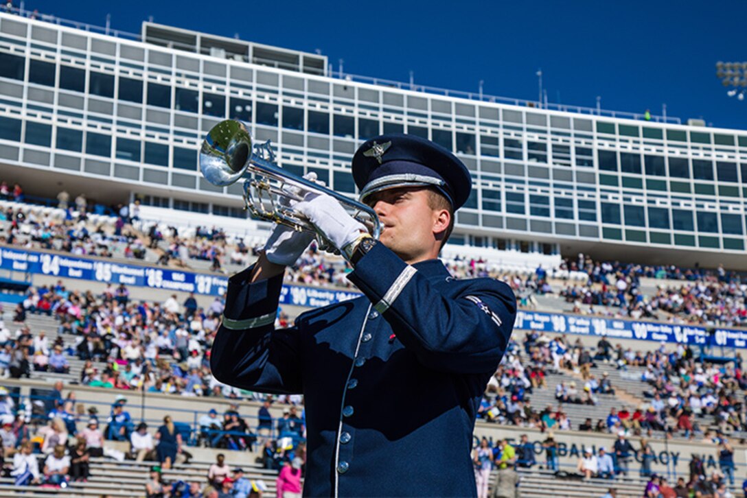 A1C Alexandru Szasz prepares to perform for the United States Air Force Academy's 2019 Graduation Ceremony on May 30th, 2019.  A1C Szasz and the Academy Band honored the nearly 1,000 graduates and welcomed the President of the United States in a ceremony viewed by nearly 33.5 million viewers worldwide.
(U.S. Air Force Photo/MSgt. Jeffrey Valentine)
