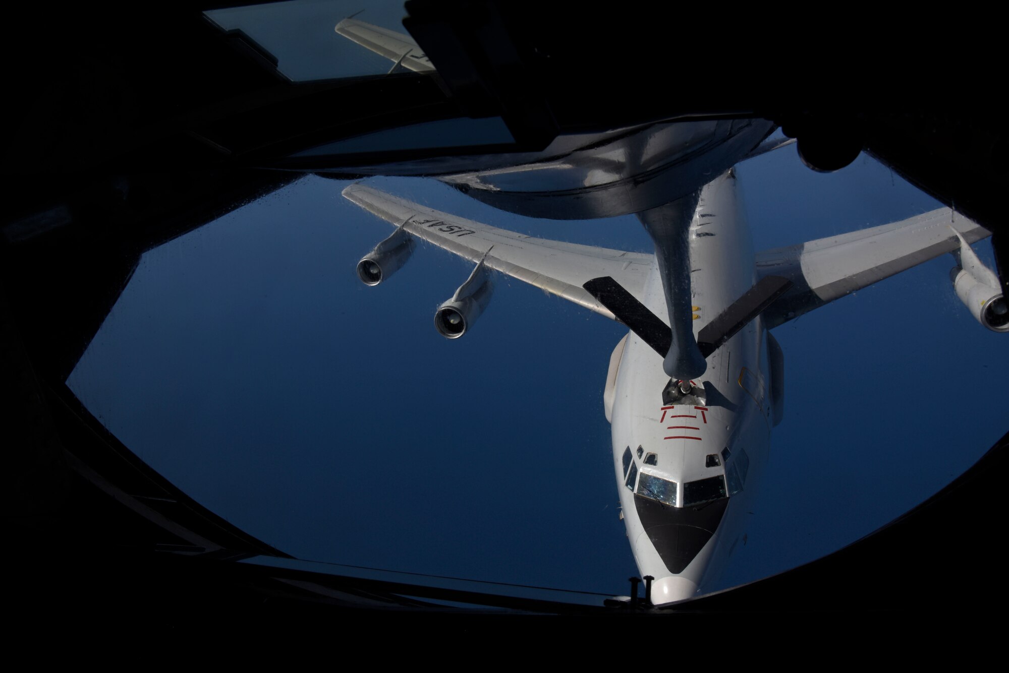 A U.S. Air Force KC-135 Stratotanker from Fairchild Air Force Base, Washington, refuels an E-3 Sentry during the first Airborne Warning and Control System World Tour over the Pacific Ocean Sept. 8, 2019. This world tour was developed by U.S. Air Combat Command as the first of its kind and for AWACS aircrew to gain pilot proficiency and become familiar with transoceanic operations in and out of the Pacific Air Force region. (U.S. Air Force photo by Senior Airman Jesenia Landaverde)